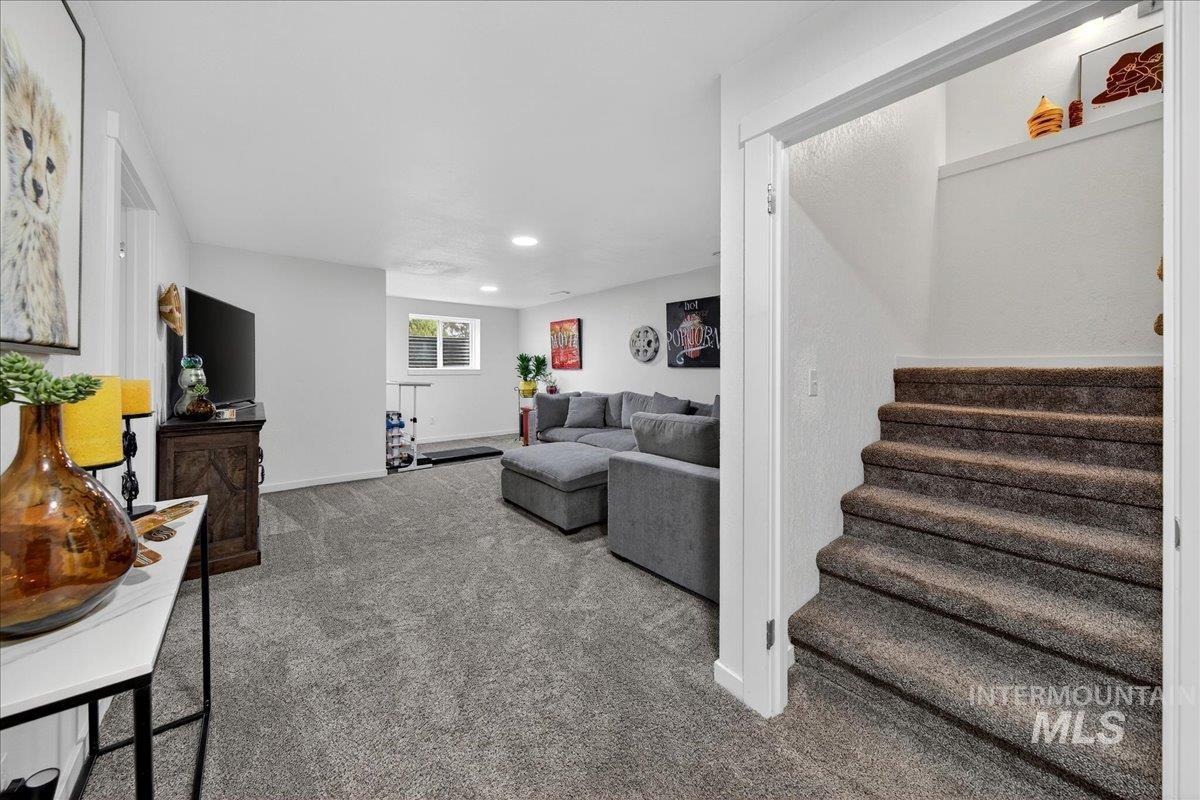 Living room featuring carpet floors and recessed lighting