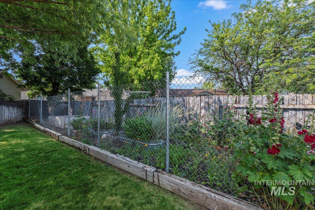 View of fenced backyard
