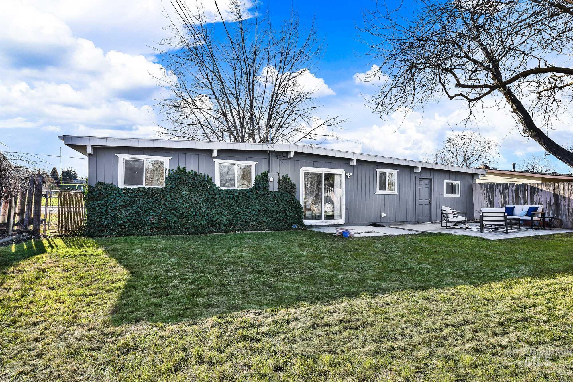 Back of house featuring a patio and an outdoor hangout area