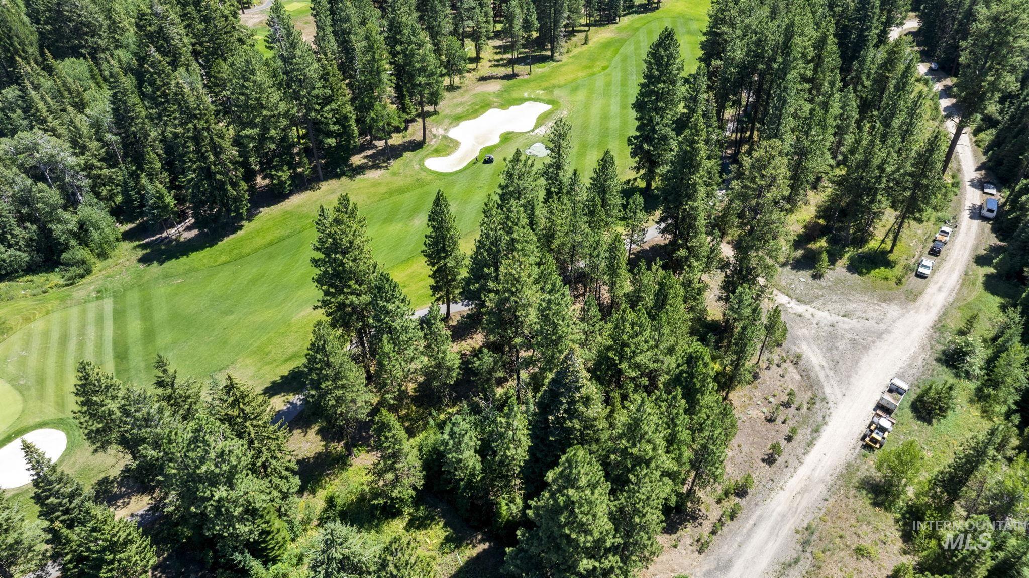 Aerial view of property's location with a local golf course