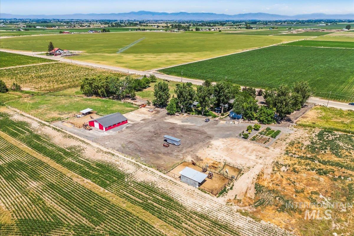 View of rural area featuring extensive farmland and a mountain backdrop