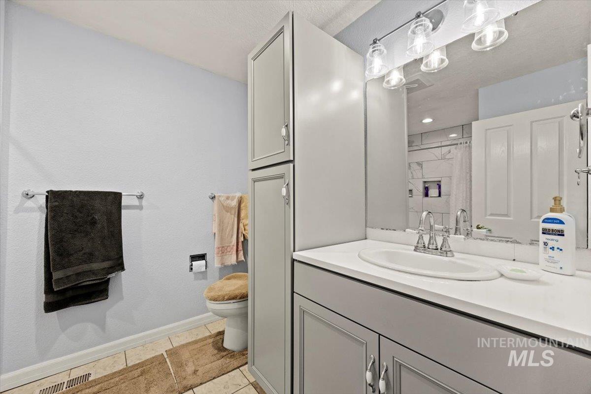 Bathroom featuring vanity and a shower with shower curtain