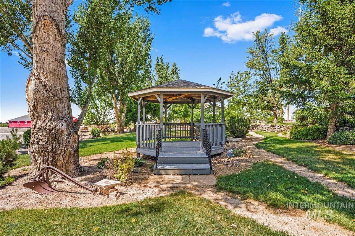 View of grassy yard featuring a gazebo
