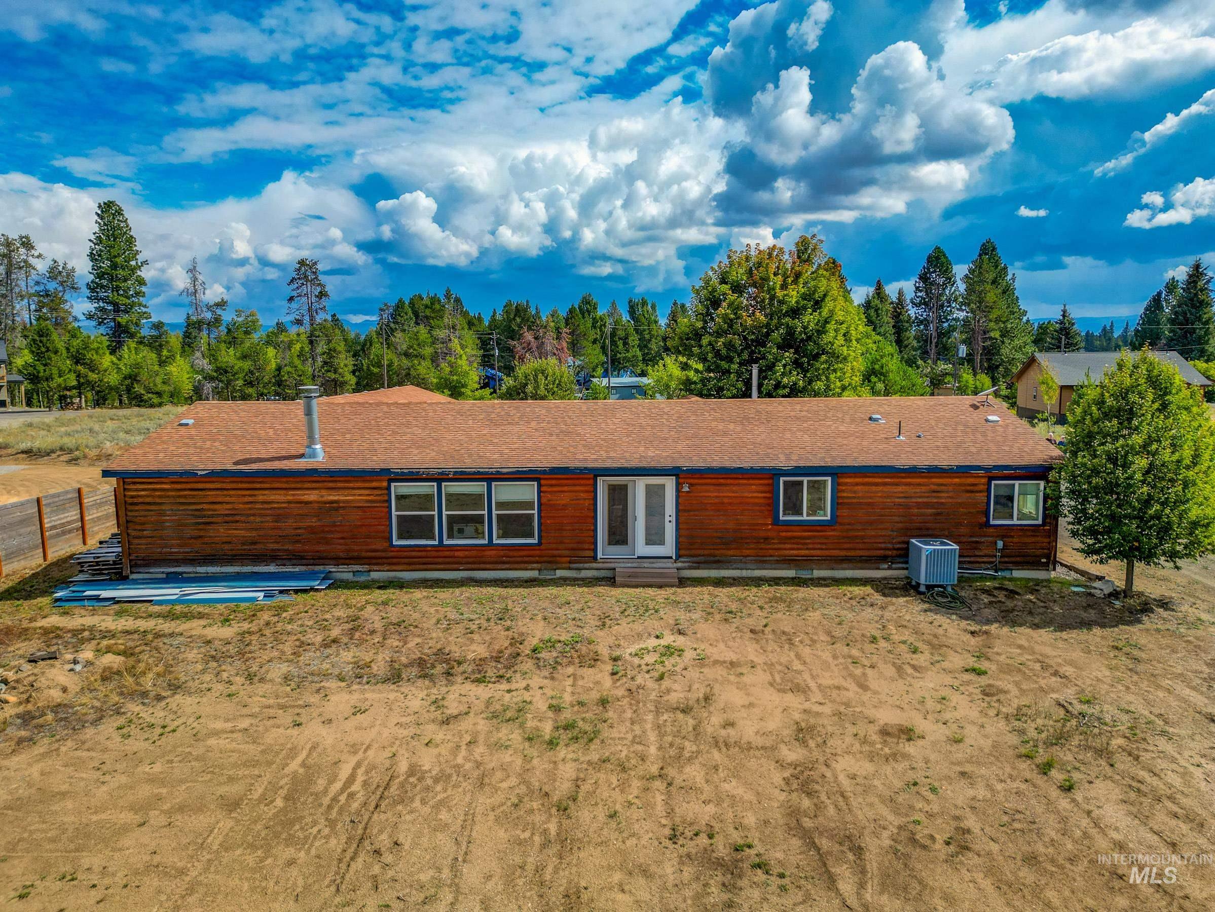 Back of house with a patio area