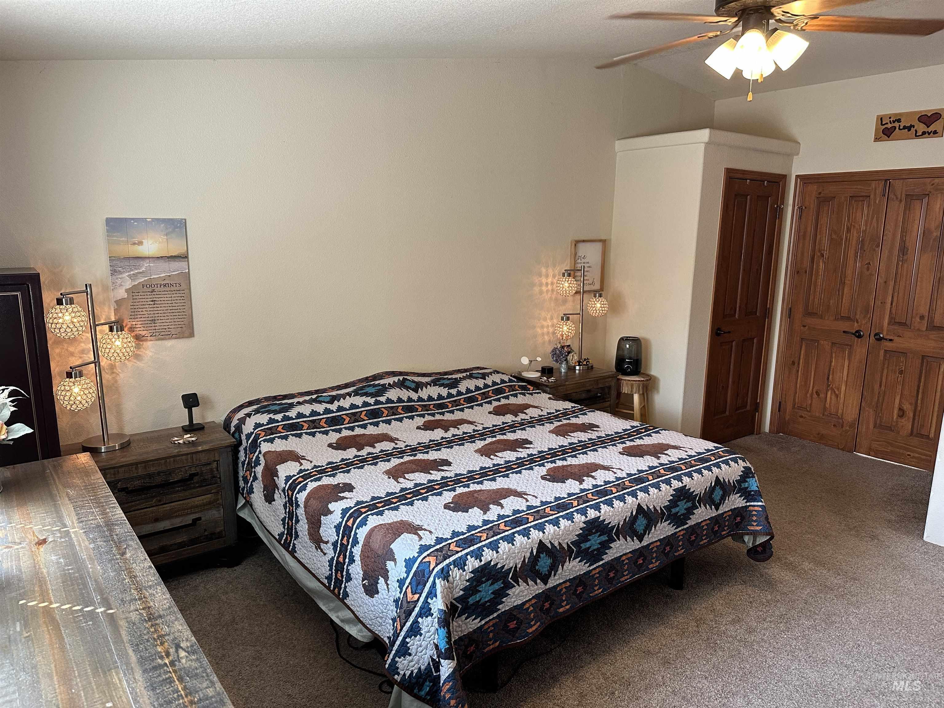 Bedroom with carpet flooring and ceiling fan