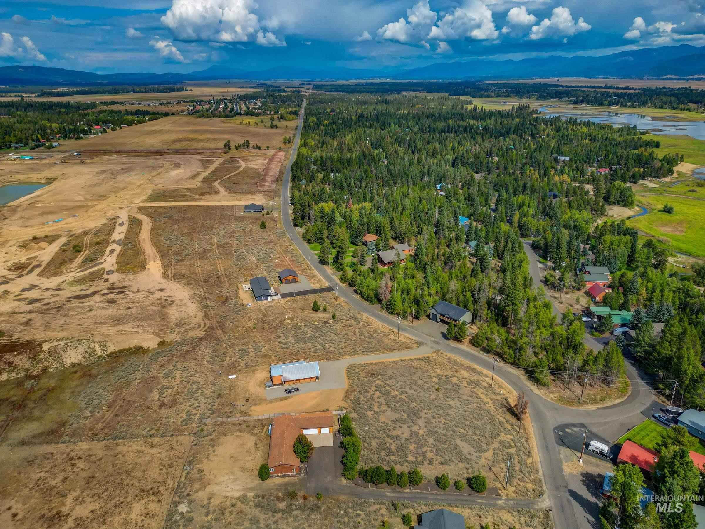 Aerial view of property's location featuring a large body of water