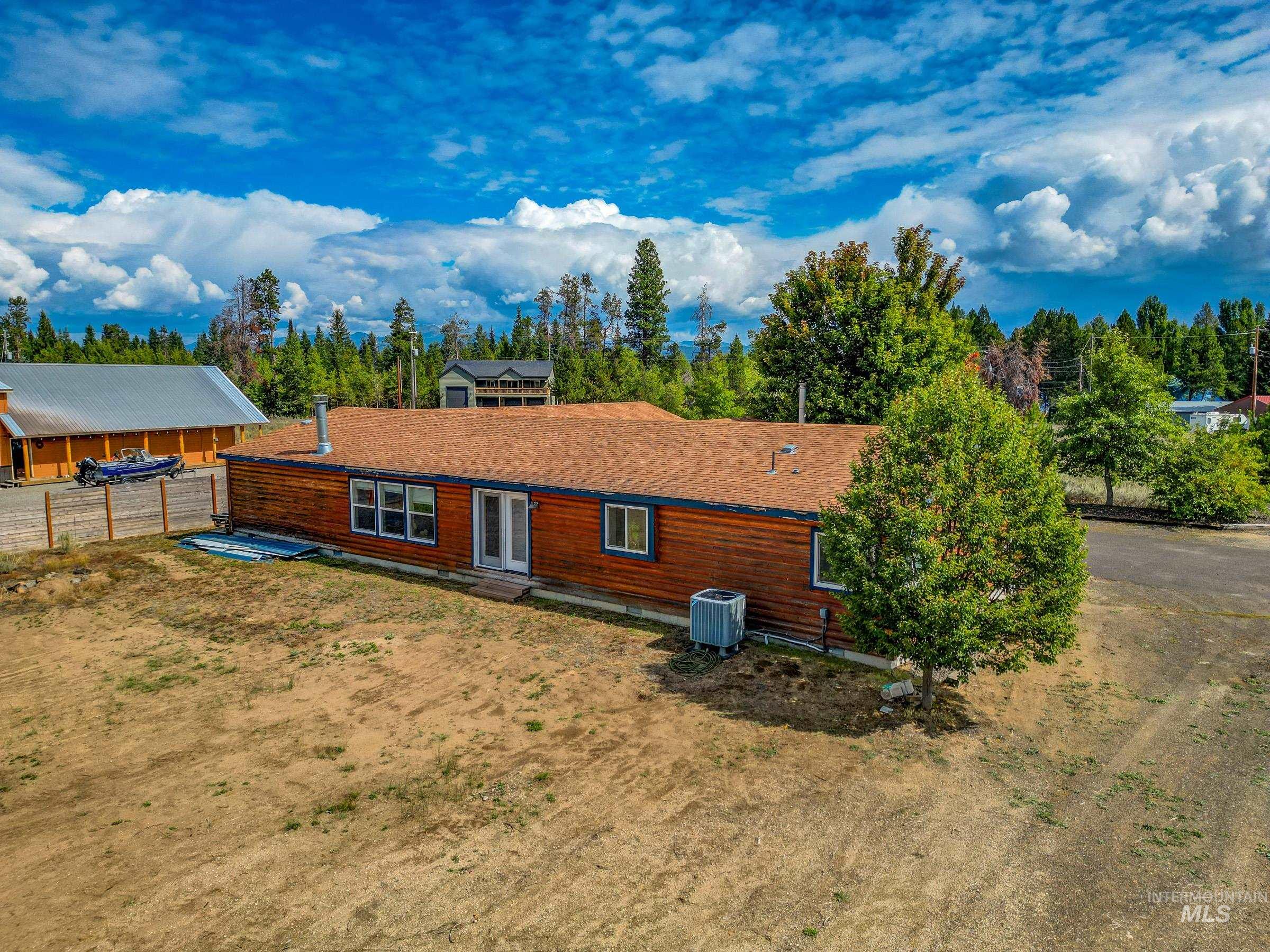 Back of property featuring a yard