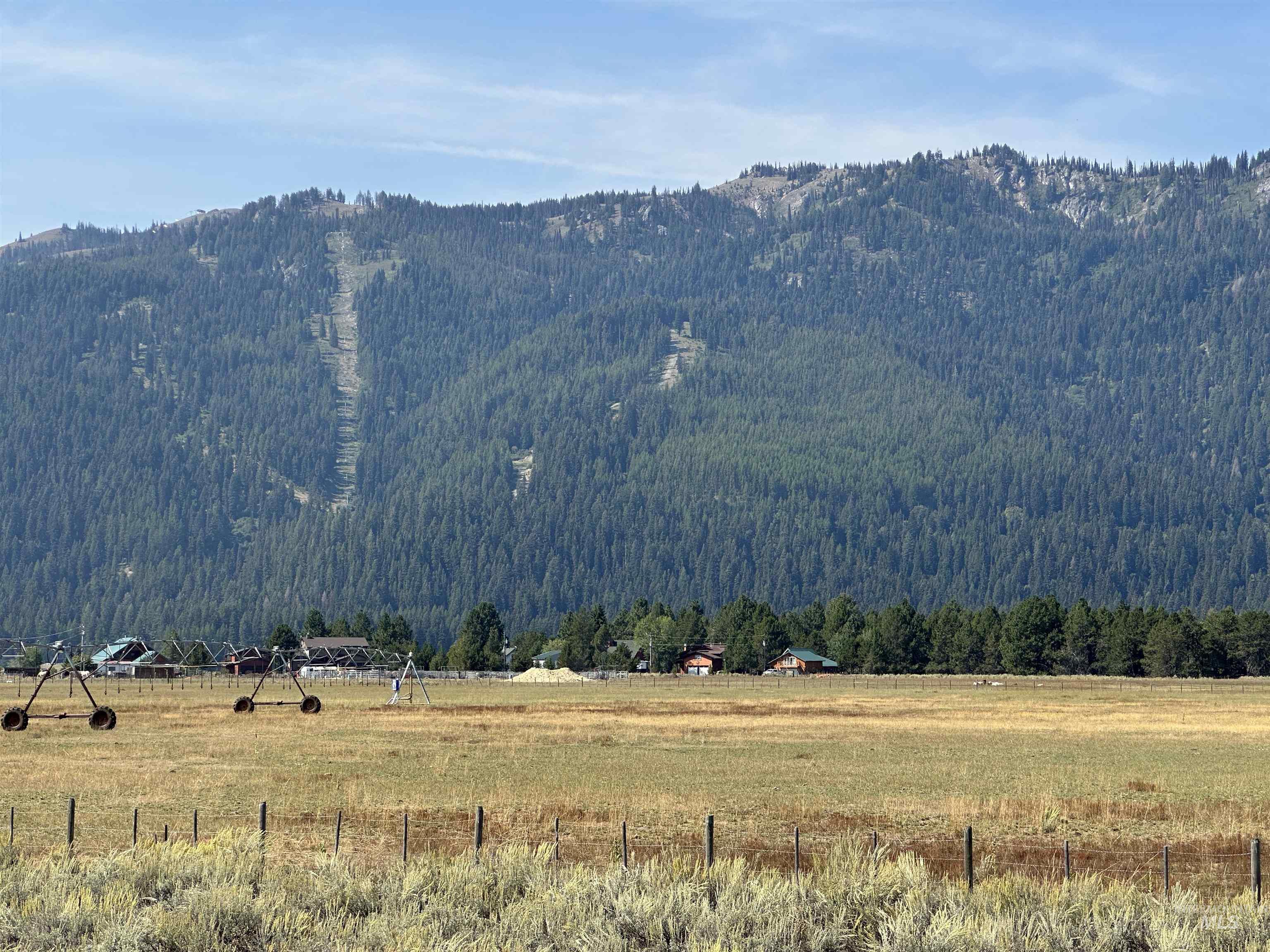 Mountain view featuring rural landscape and a heavily wooded area