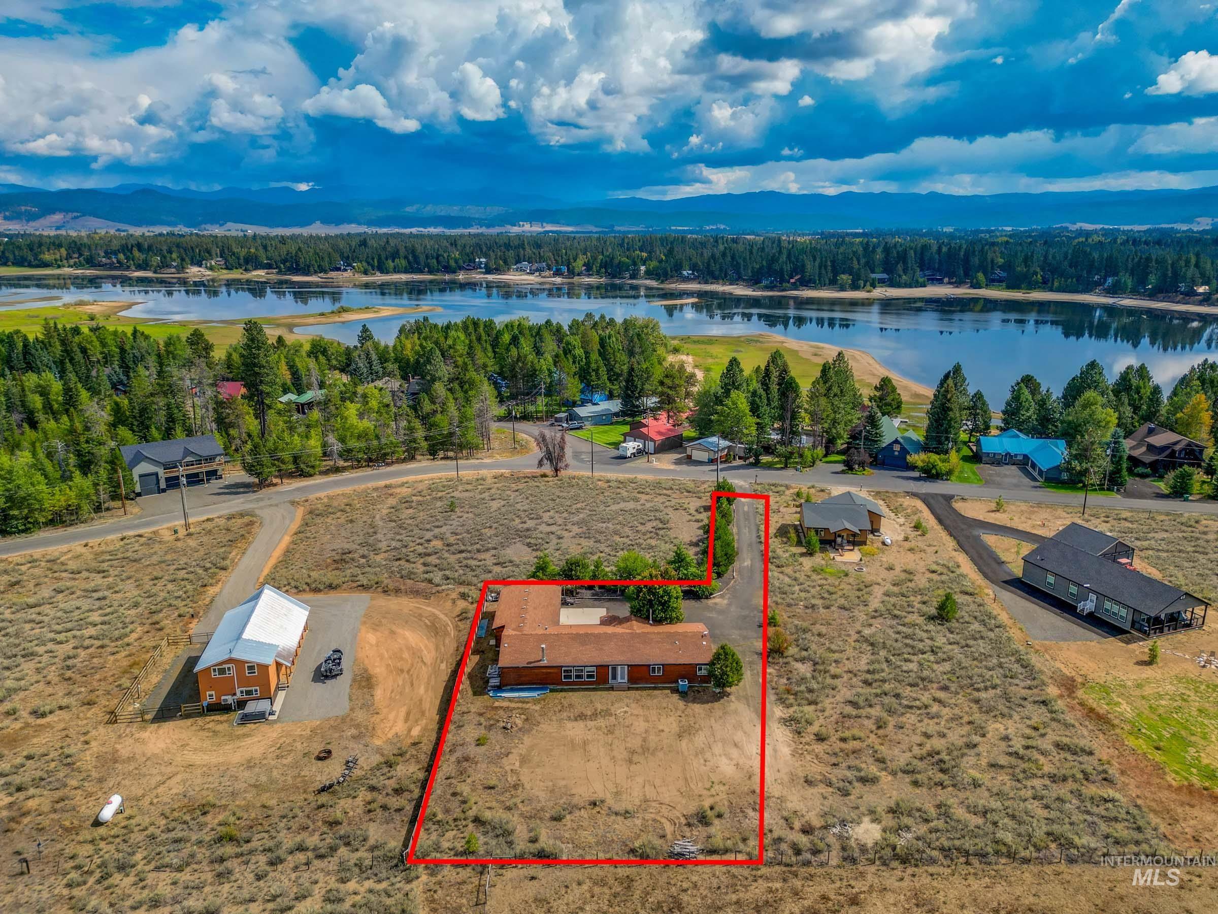 View of property location with property boundaries highlighted and a nearby body of water