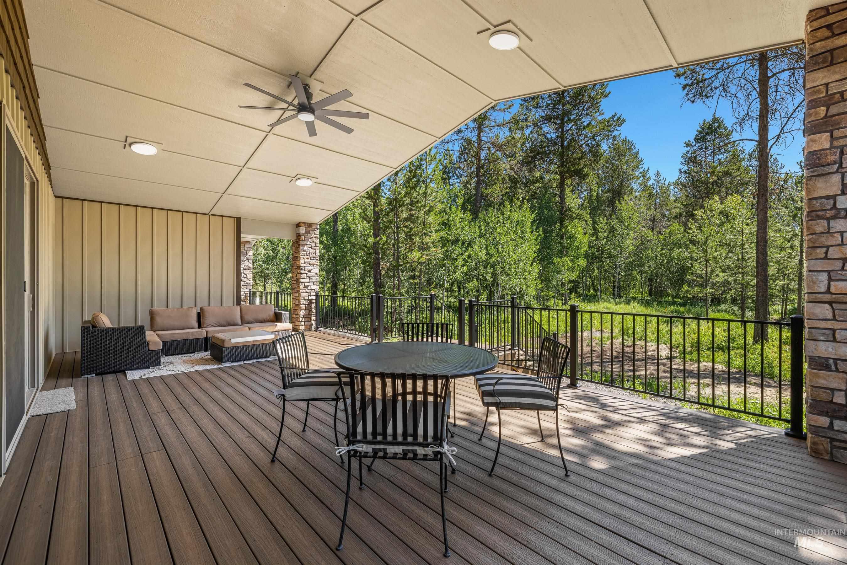 Great outdoor entertaining area sits above the lagoon and is so peaceful with the wooded public land behind the house. Extra entertaining space on those warm summer evenings. Ceiling fans and adjustable can lighting allows the party to continue after dark