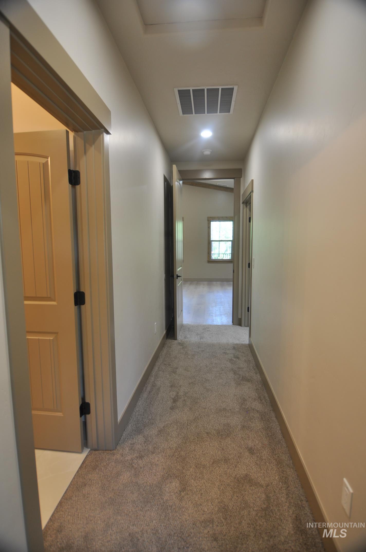 Accesses two bedrooms and a bathroom. Door to living room can be closed off.