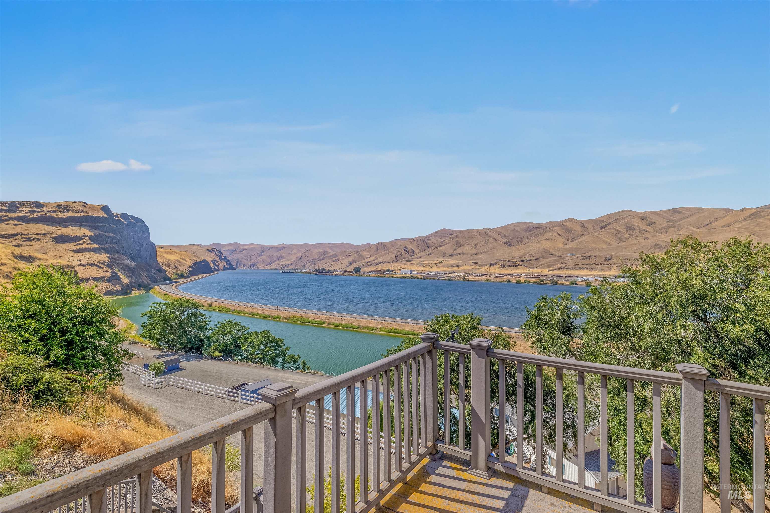 Balcony with a water and mountain view