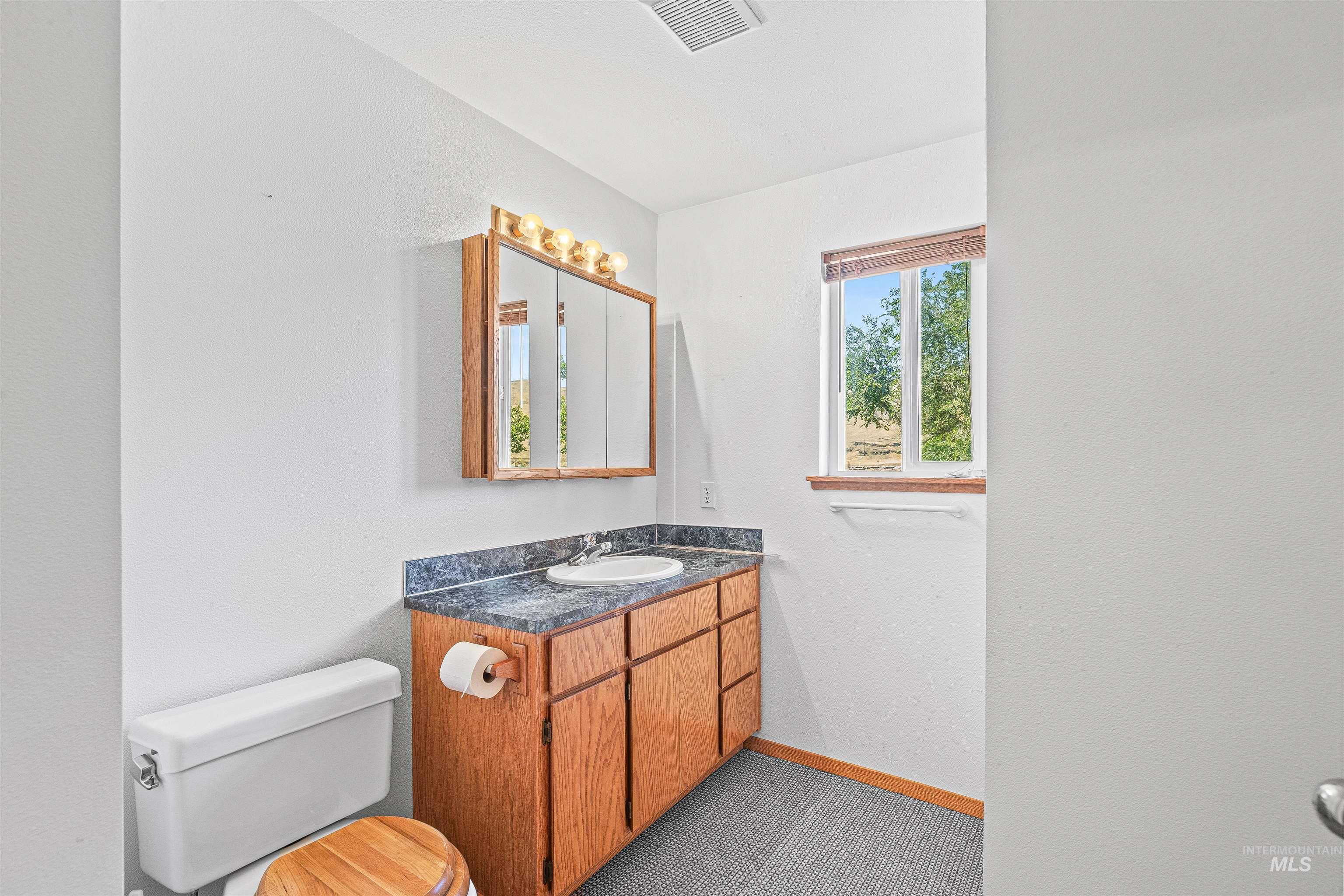 Bathroom with toilet and vanity