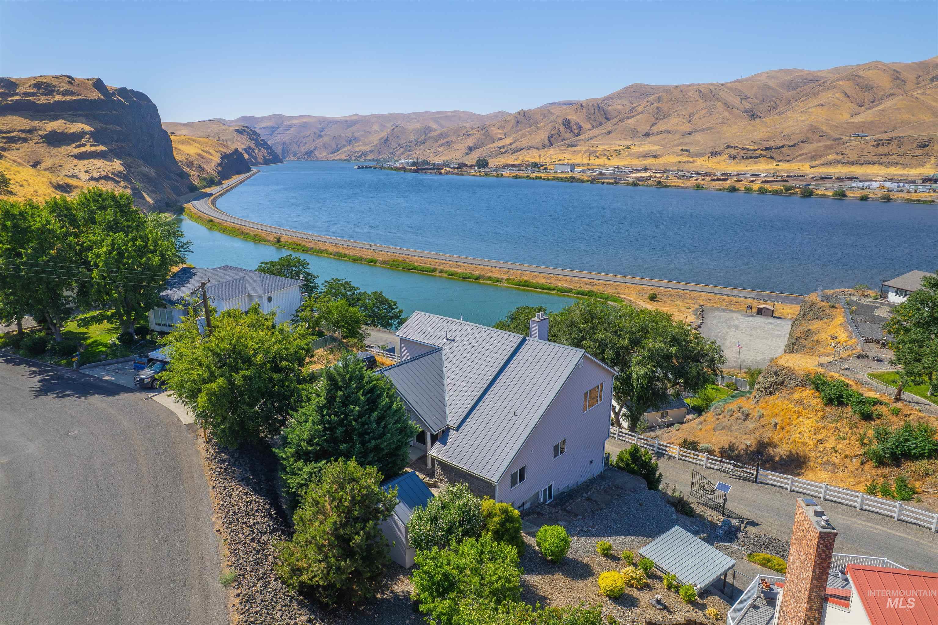 View from above of property featuring a water and mountain view