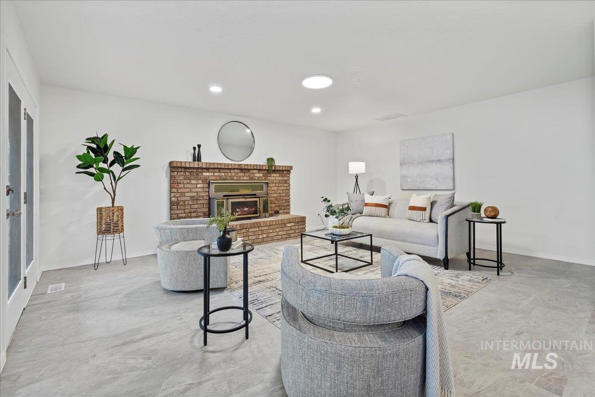 Living area featuring a fireplace and recessed lighting
