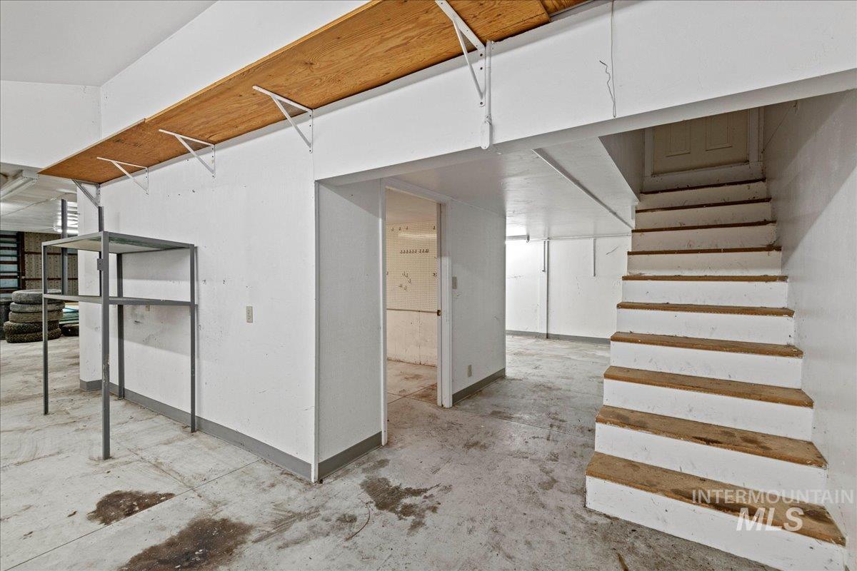 Unfinished basement with stairs