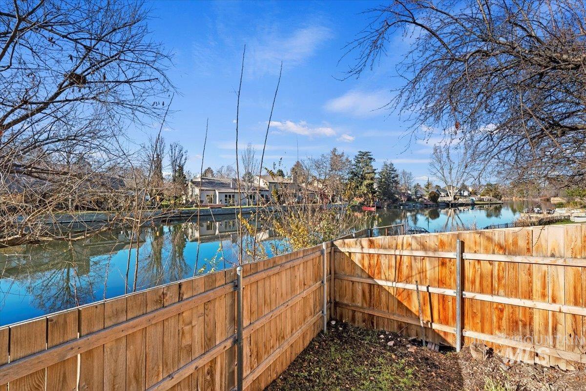 View of yard with a water view