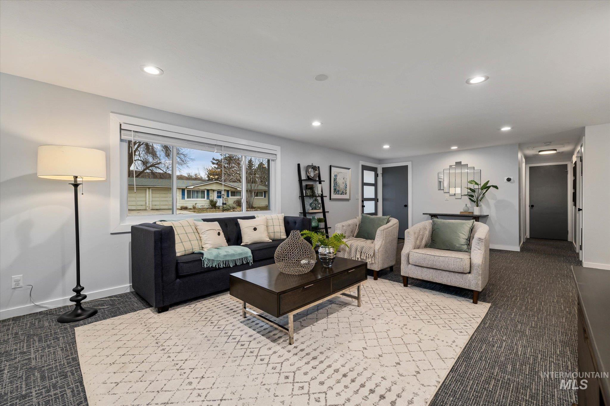 Living room with carpet floors and recessed lighting