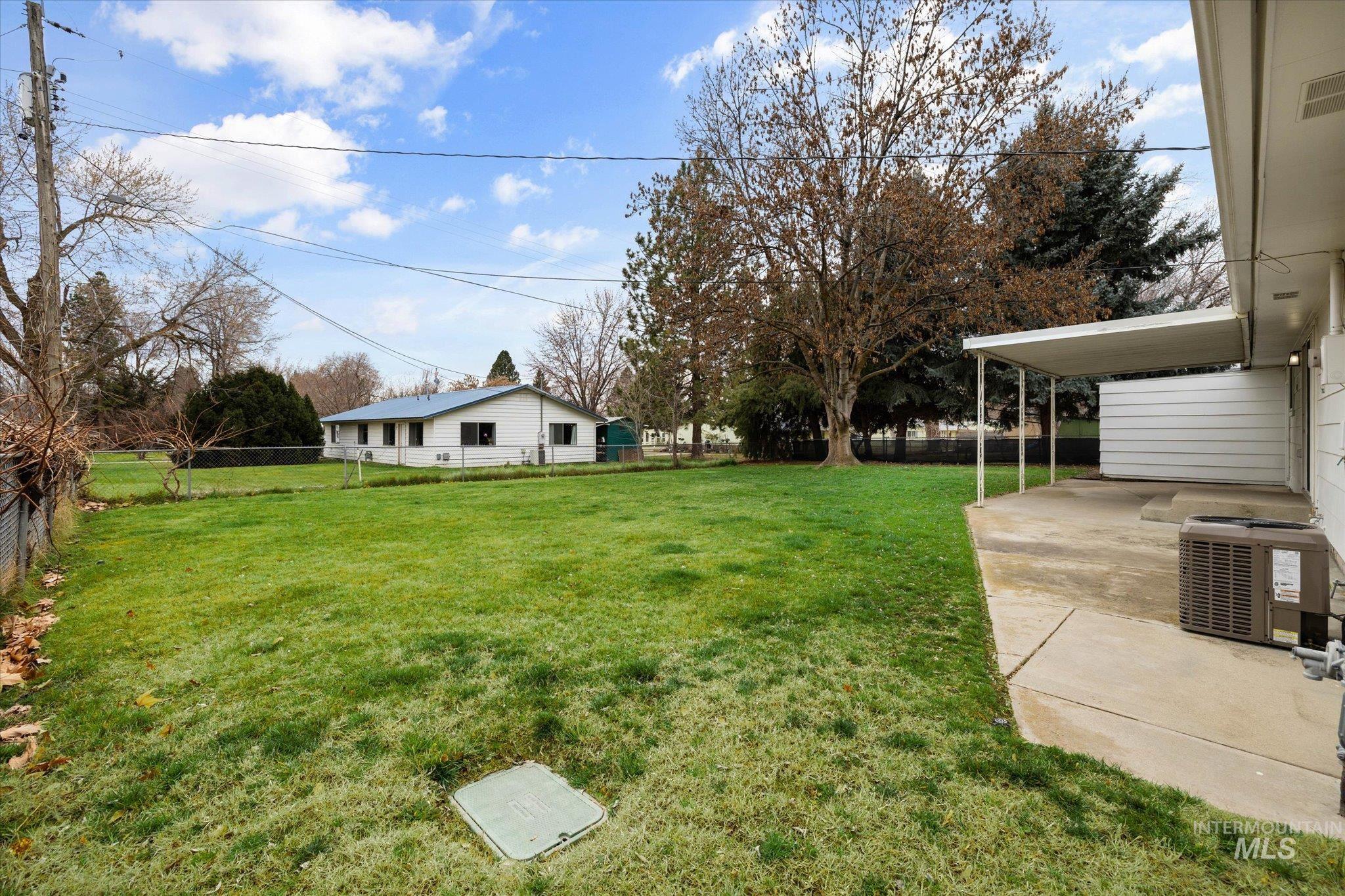 View of fenced backyard