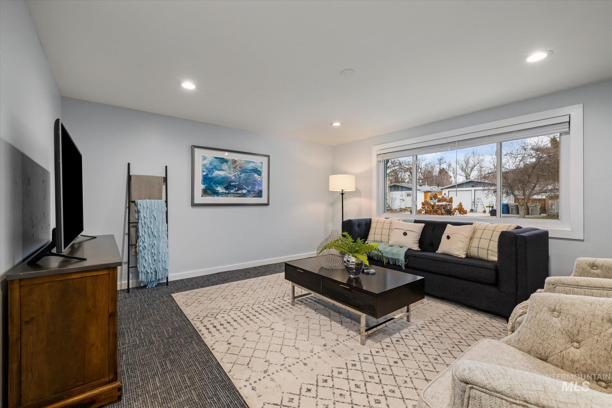 Living room with carpet floors and recessed lighting