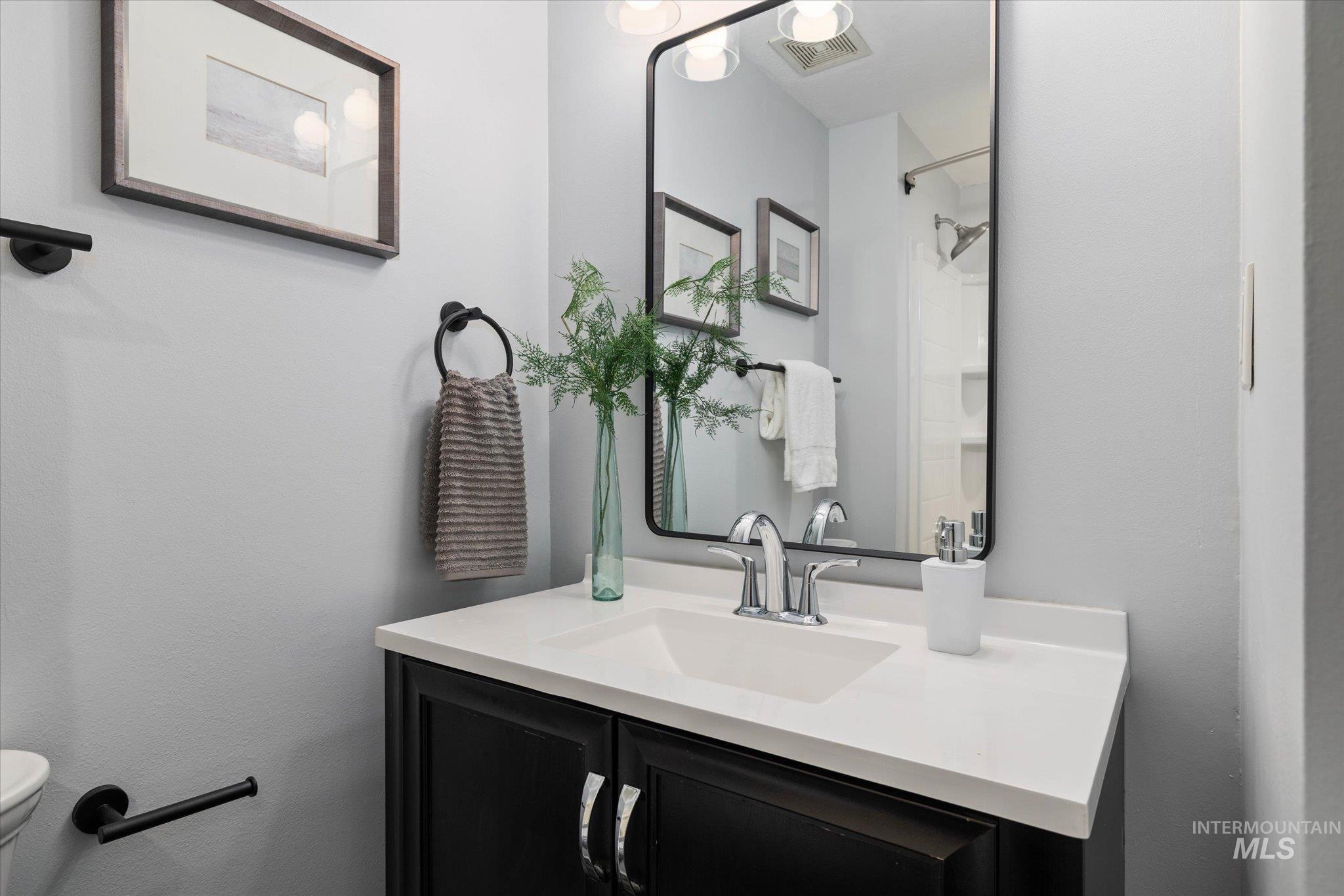 Bathroom featuring vanity and toilet