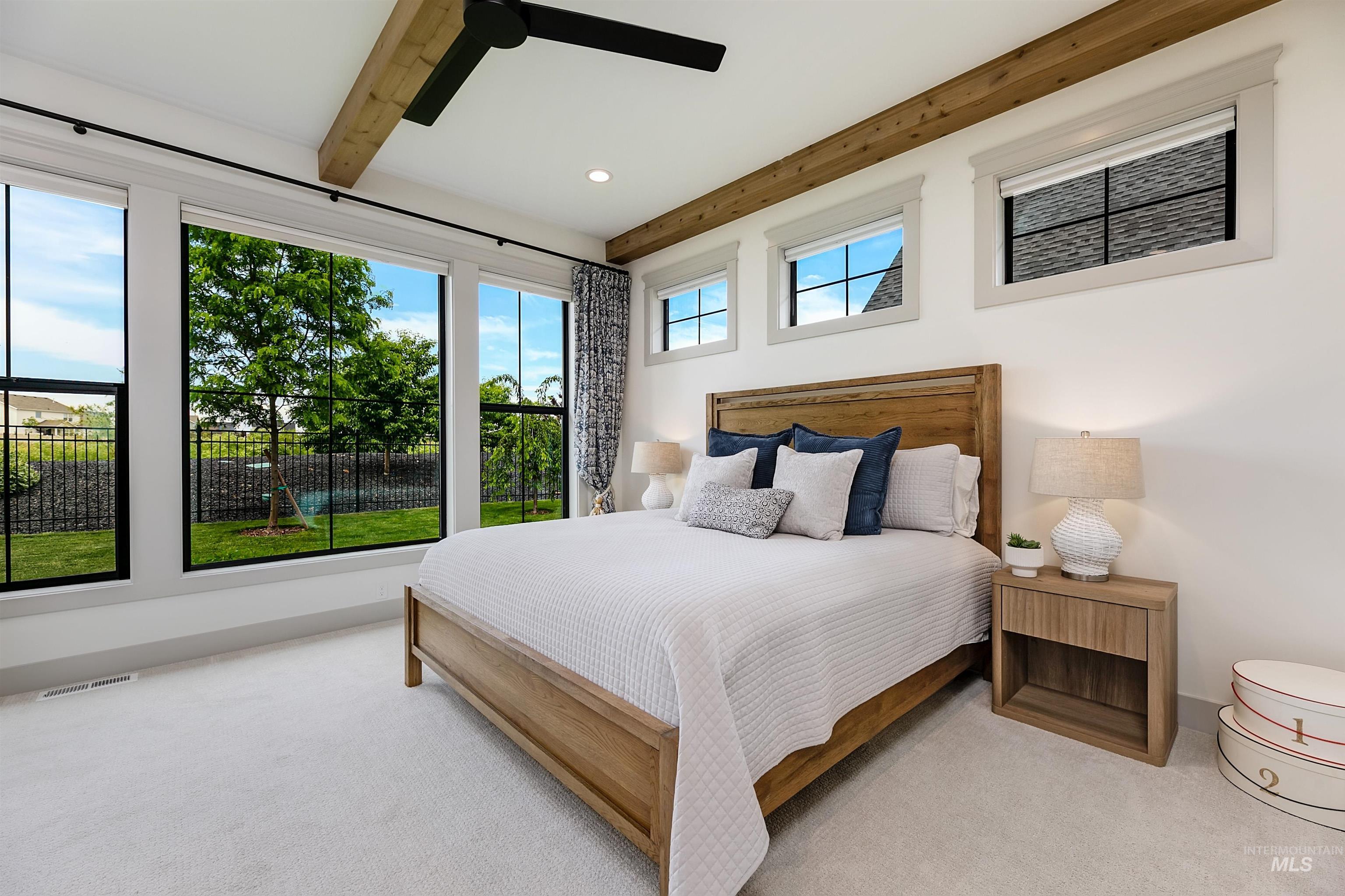 Bedroom featuring expansive windows with black framing, exposed wood ceiling beams, recessed lighting, a ceiling fan, and light-colored carpet flooring