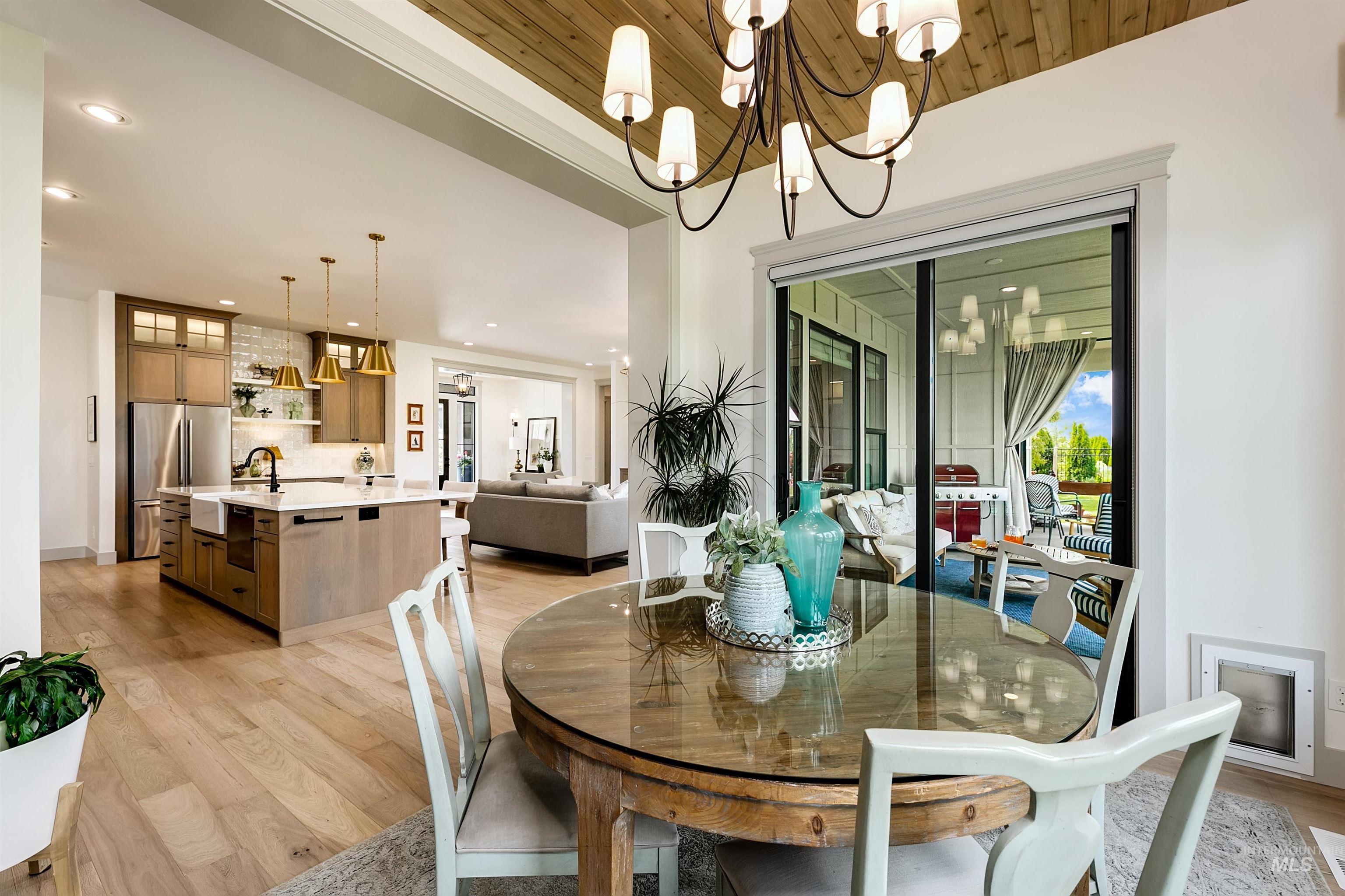 Open-concept living space featuring wood-finish flooring and a wood-paneled ceiling