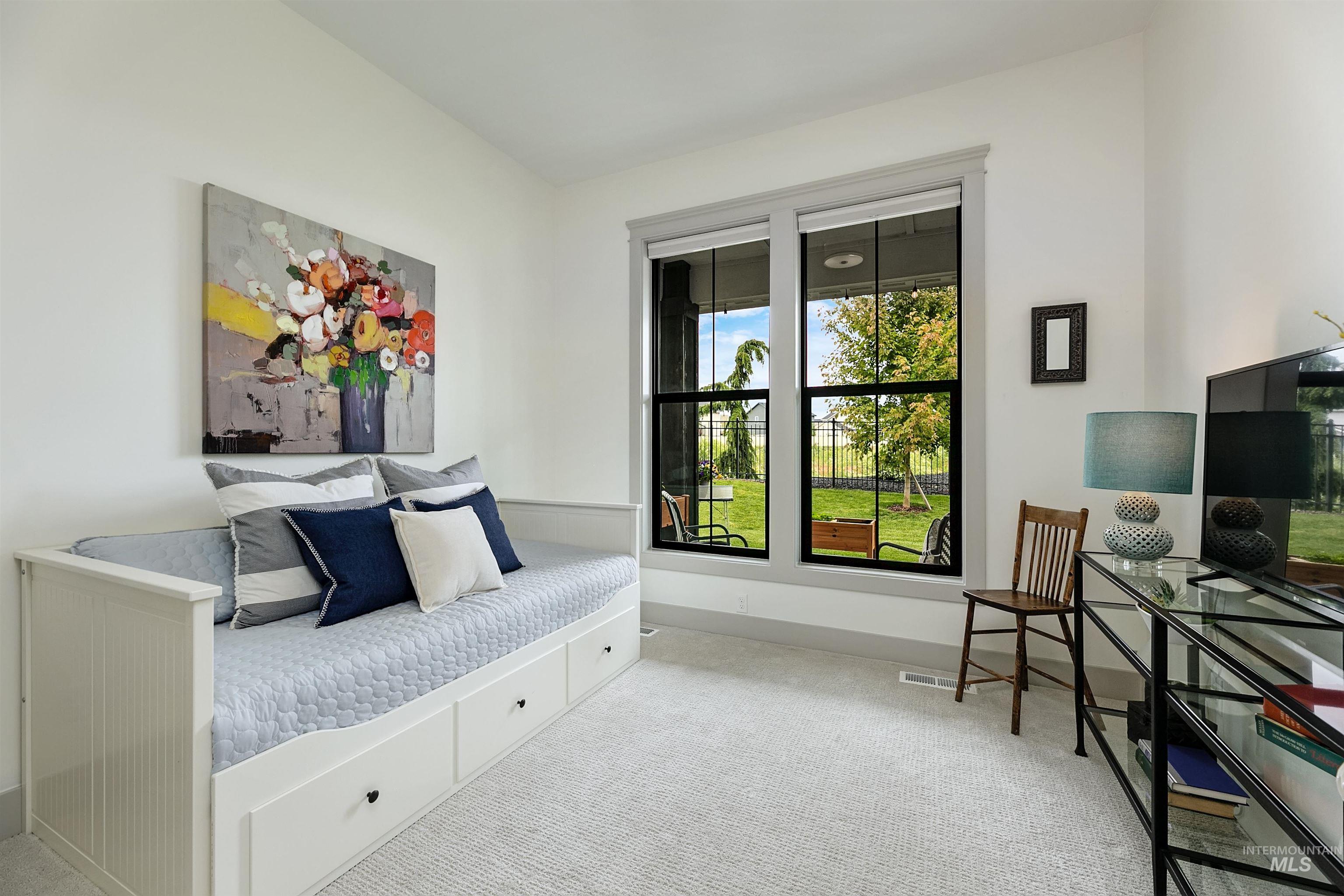 Bright room with two large windows offering abundant natural light