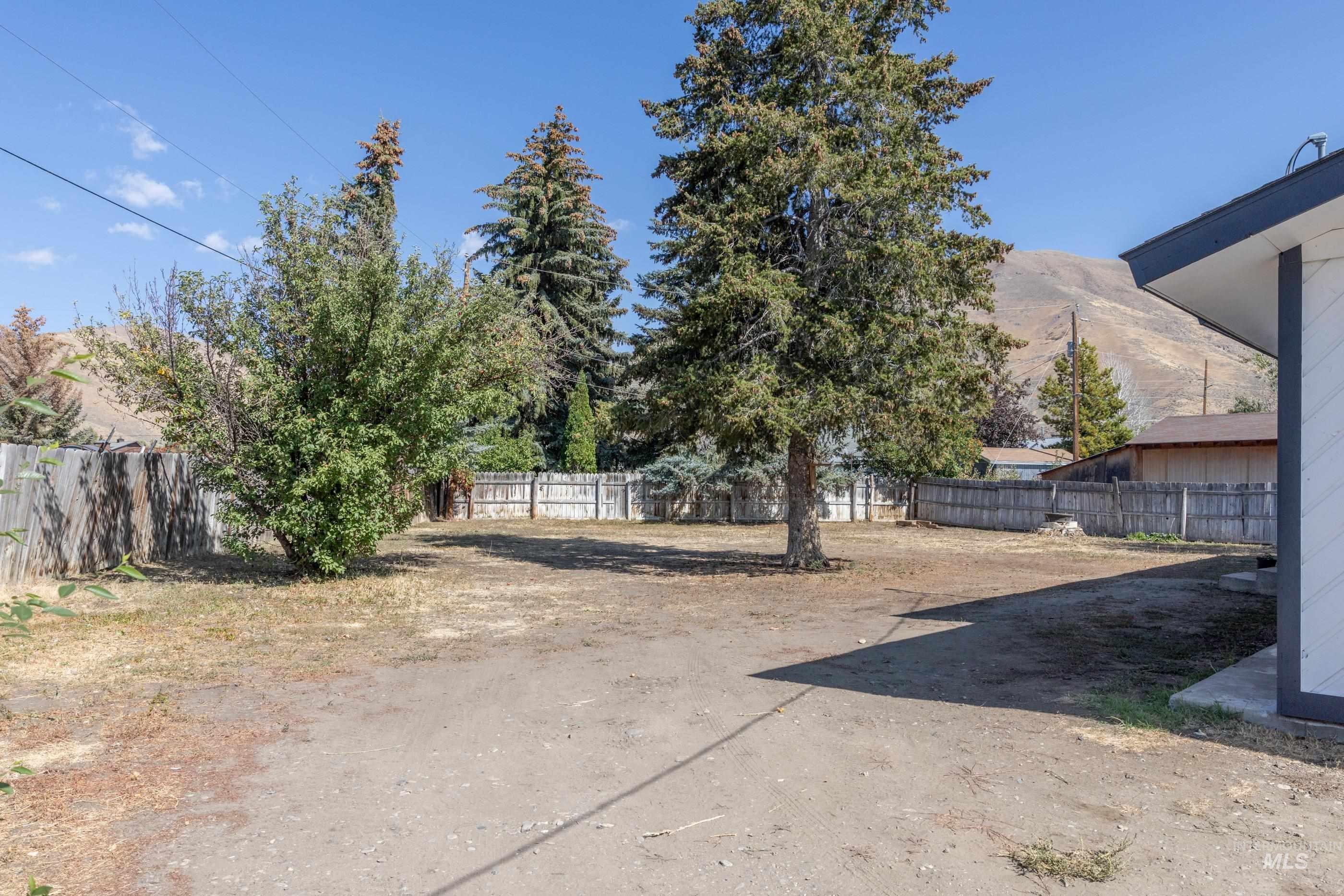 View of fenced backyard