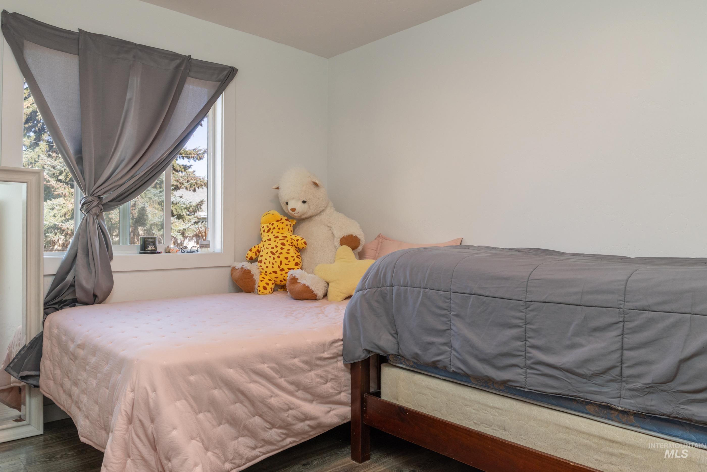 Bedroom with wood finished floors