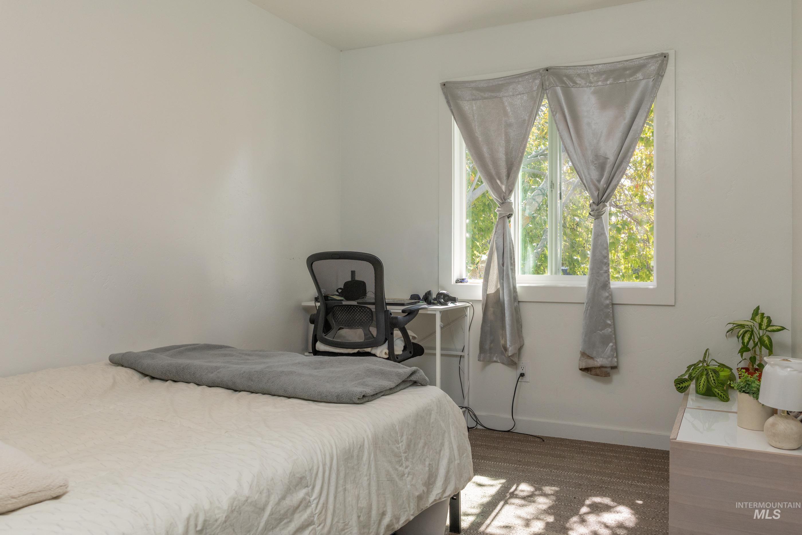 Bedroom featuring baseboards