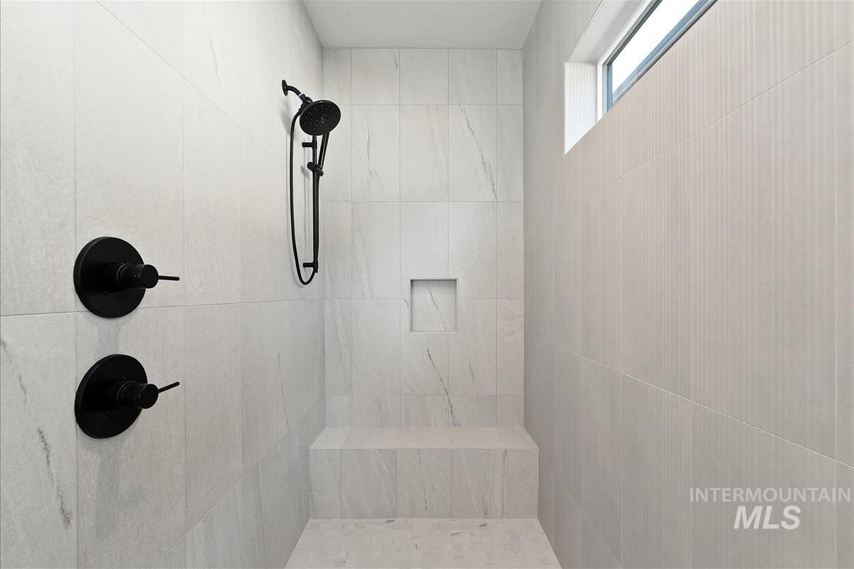 Bathroom featuring tiled shower
