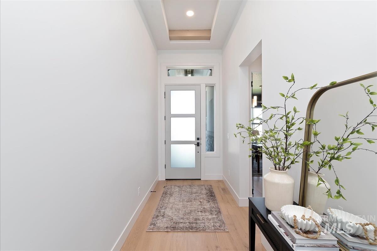 Entryway featuring light wood finished floors and baseboards