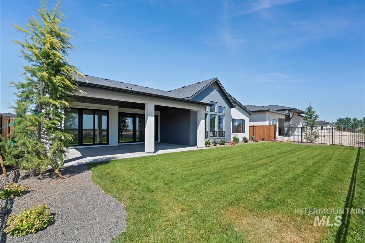 Back of property with a patio area and stucco siding