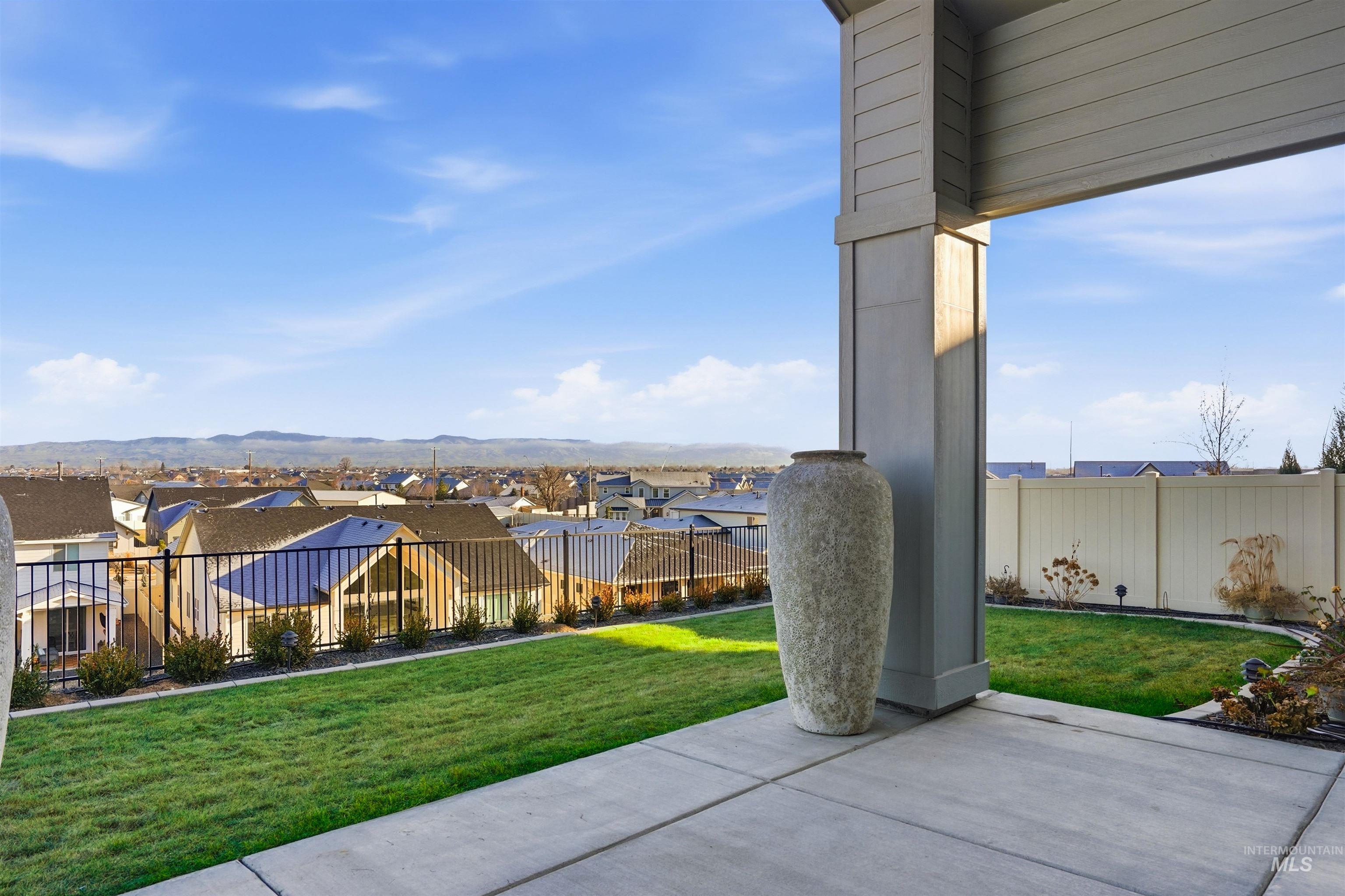 View of patio / terrace with a residential view and a mountain view