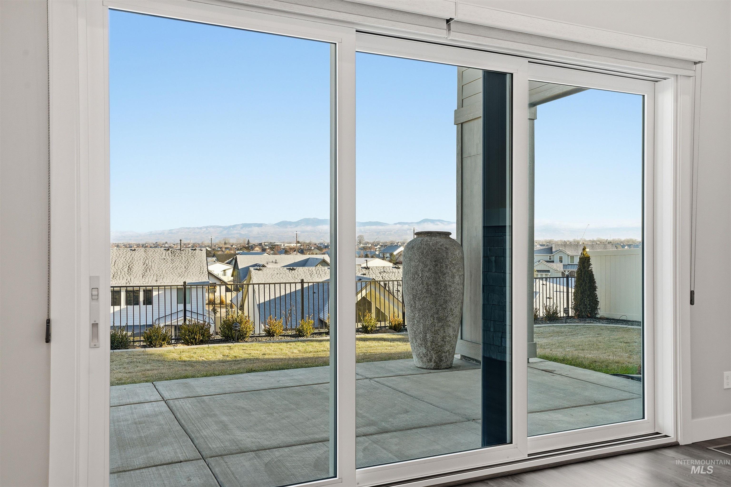 Doorway to outside featuring a residential view
