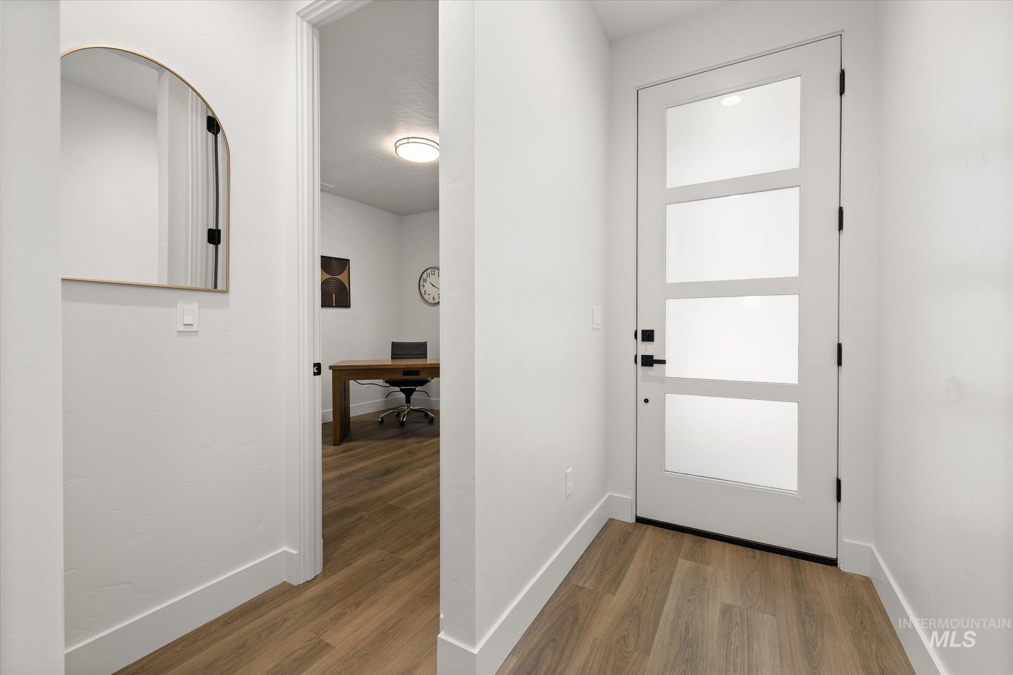 Entryway featuring an office area and wood finished floors