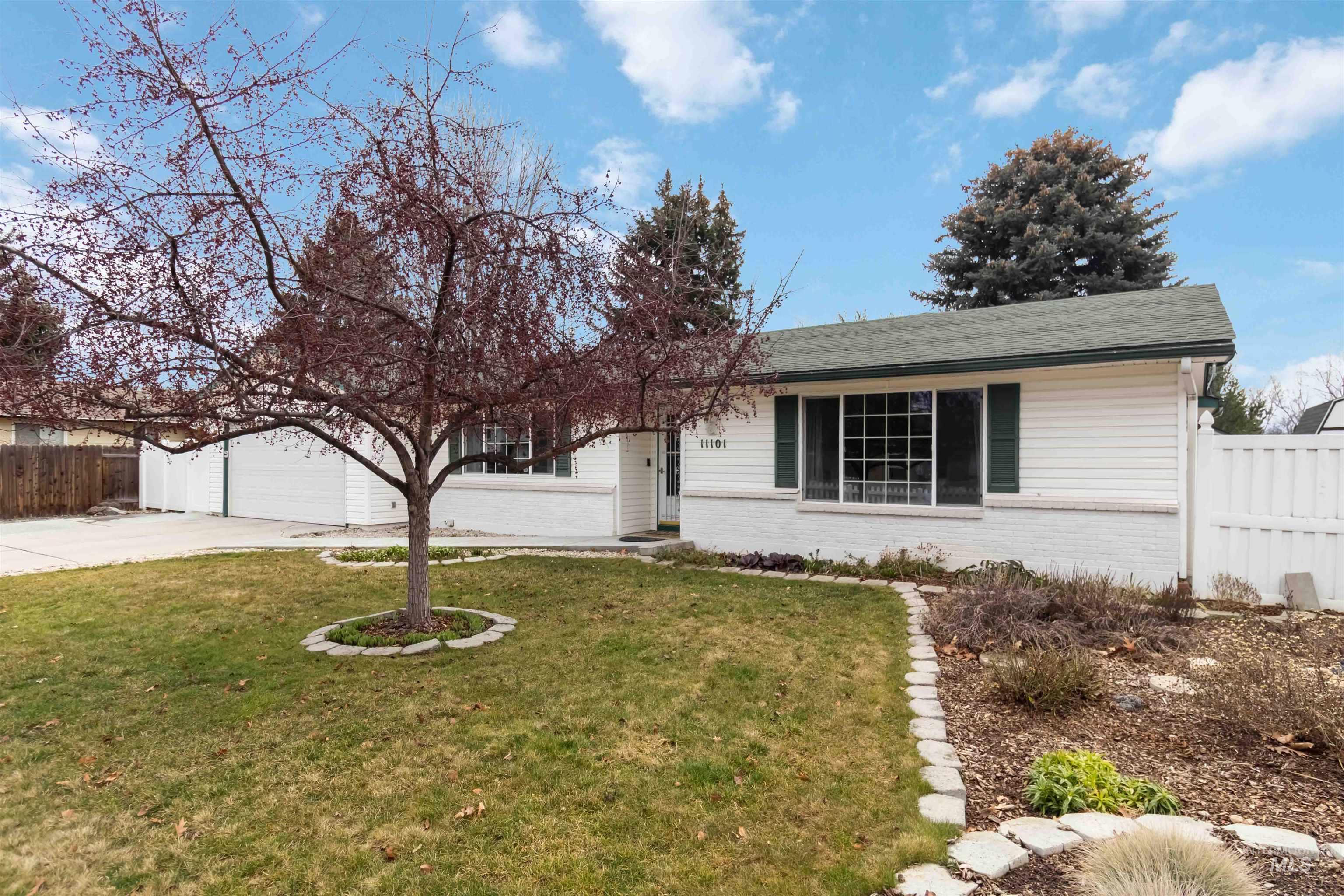 Ranch-style house with brick siding, driveway, a garage, and a shingled roof