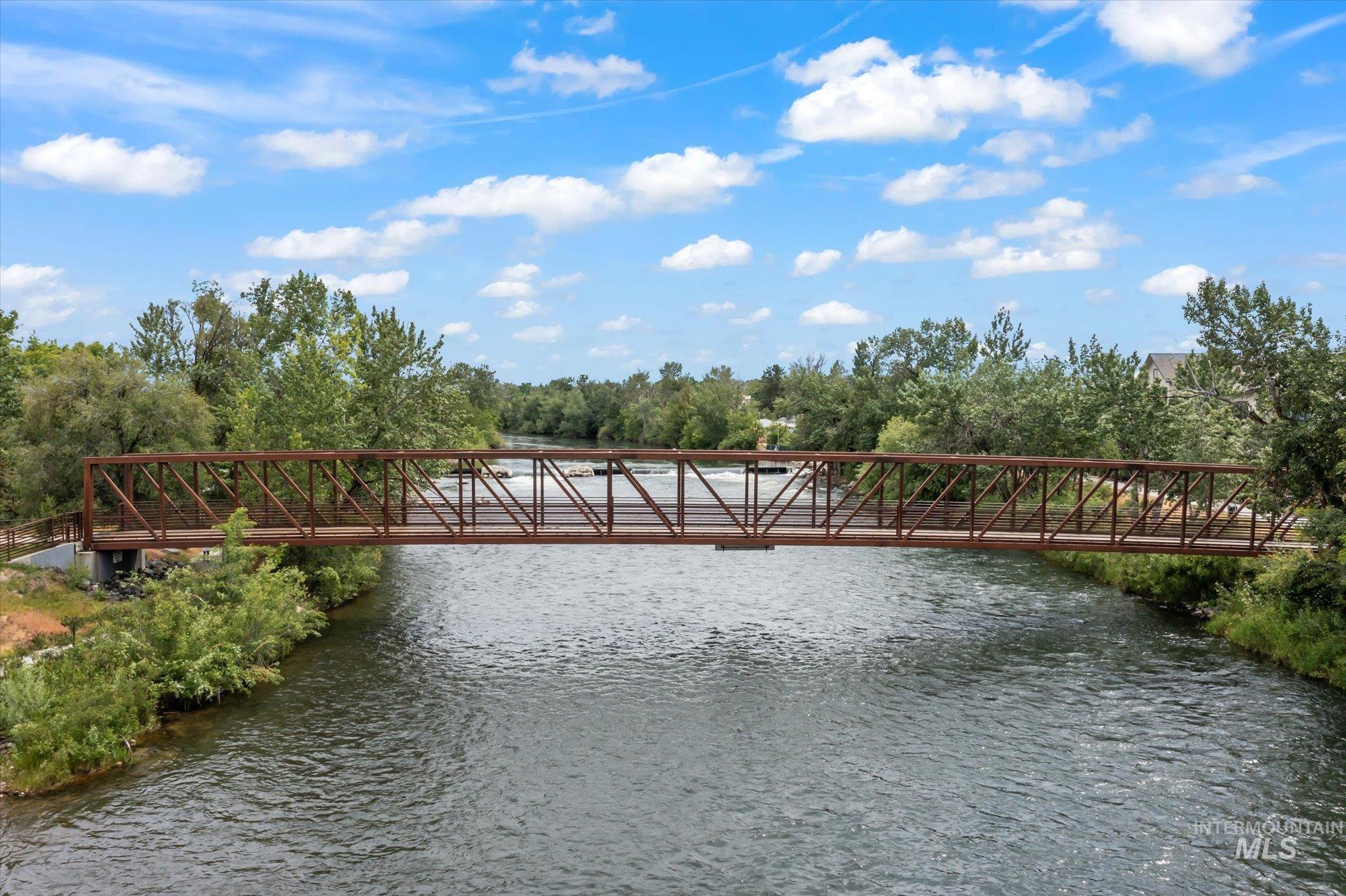Gate featuring a water view and view of scattered trees