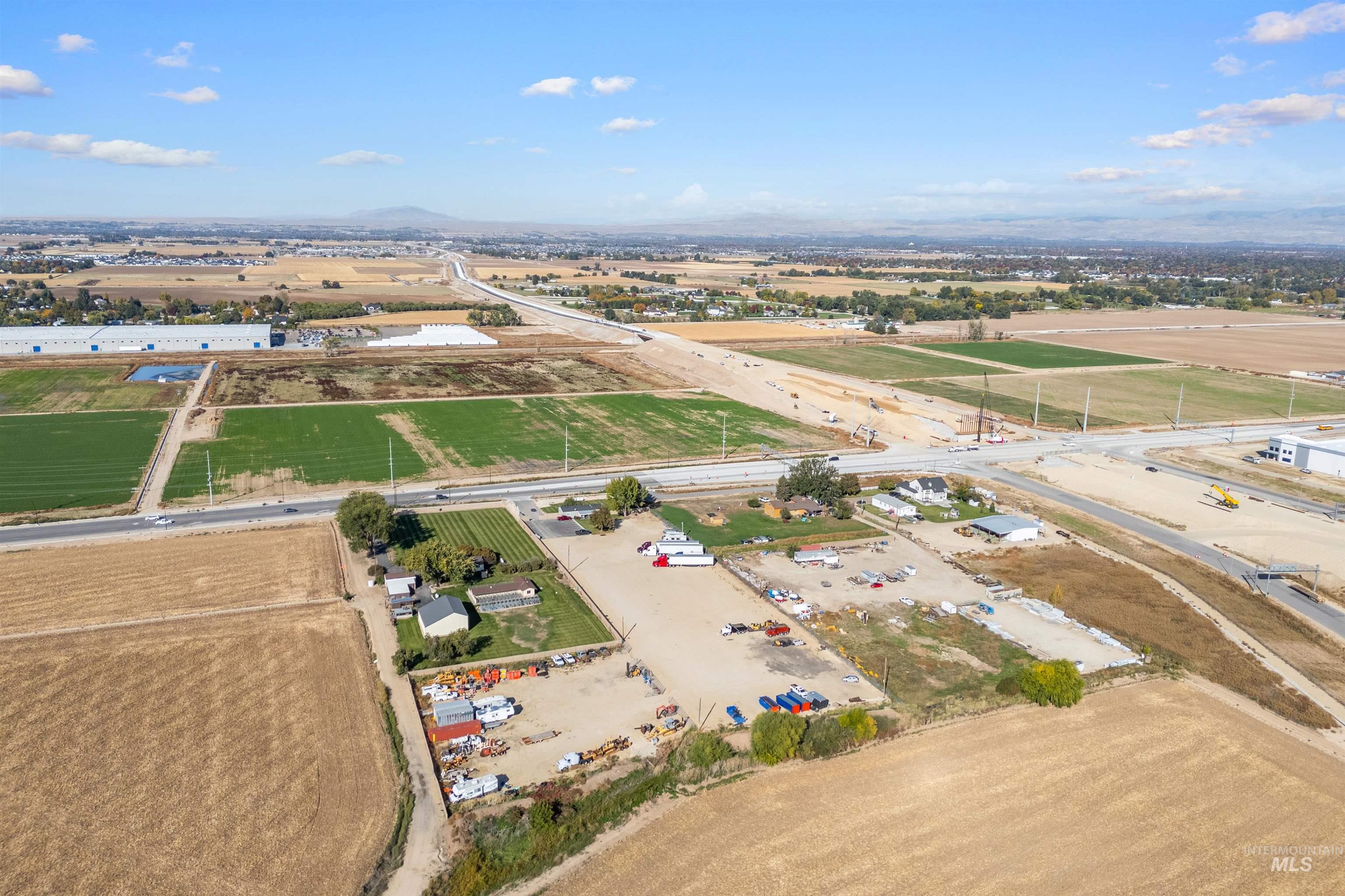 Aerial view of property's location with rural landscape and rows of crops