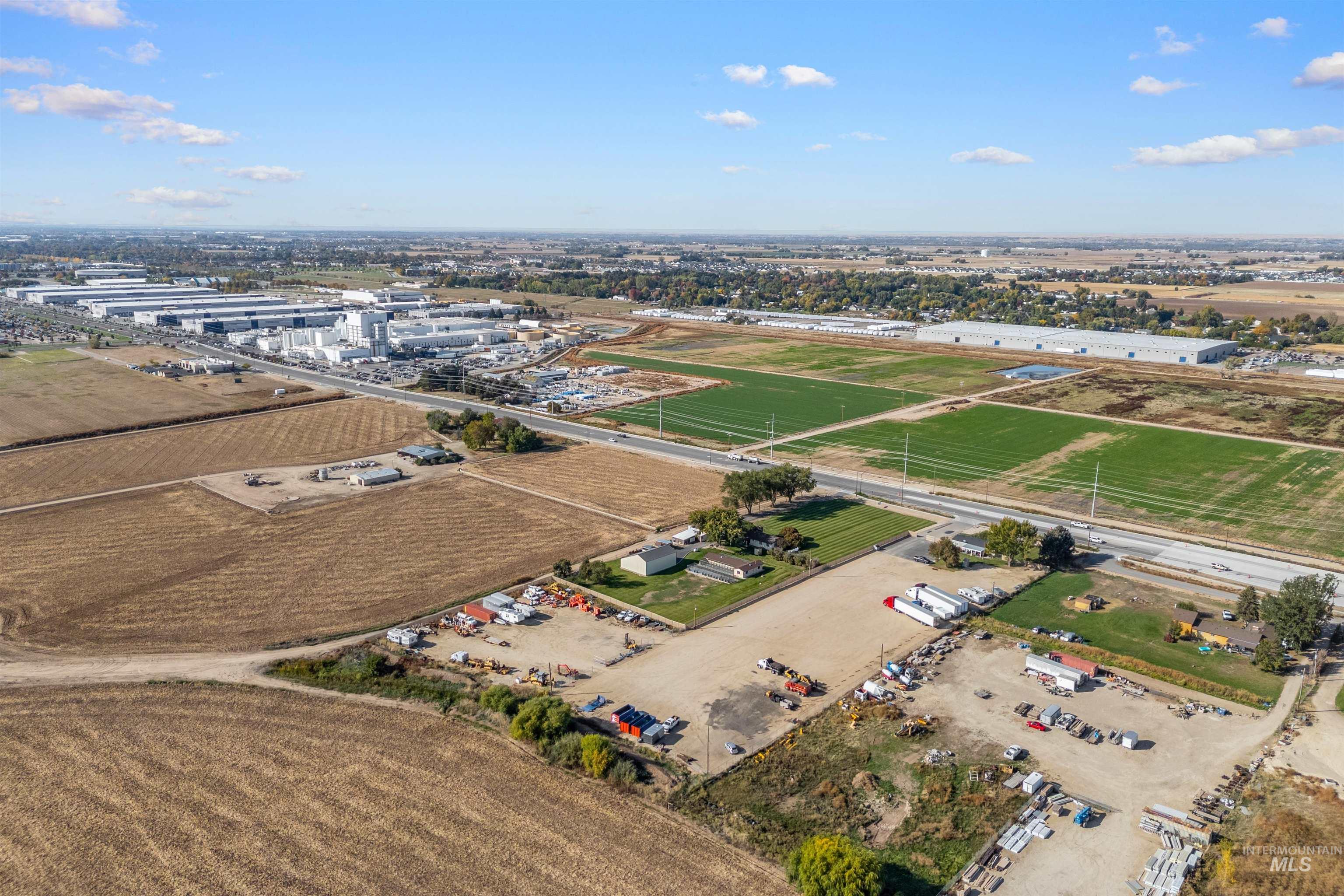Aerial view of sparsely populated area featuring farmland