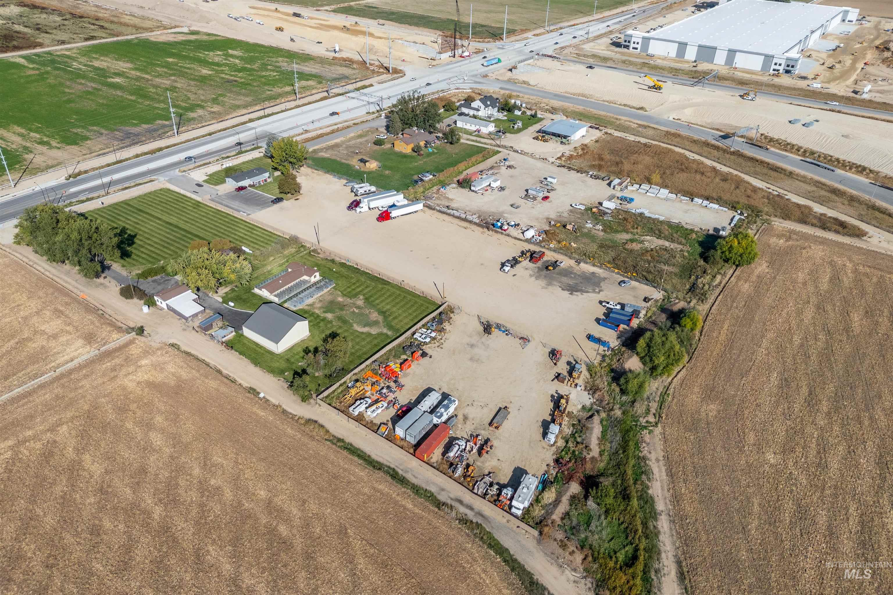Aerial view of property and surrounding area with rural landscape and extensive farmland
