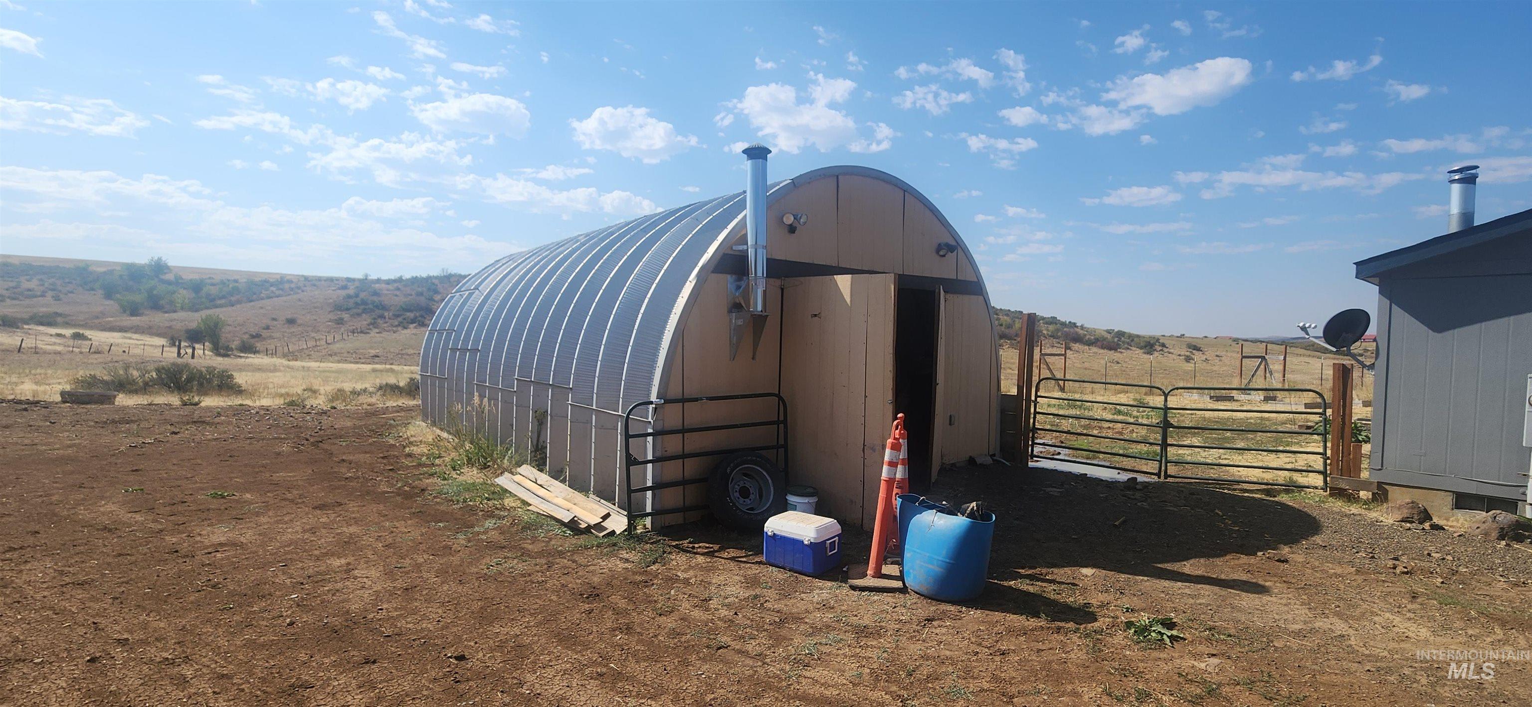 View of outdoor structure with a view of rural / pastoral area