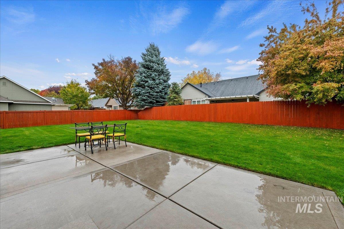 Fenced backyard featuring a patio area