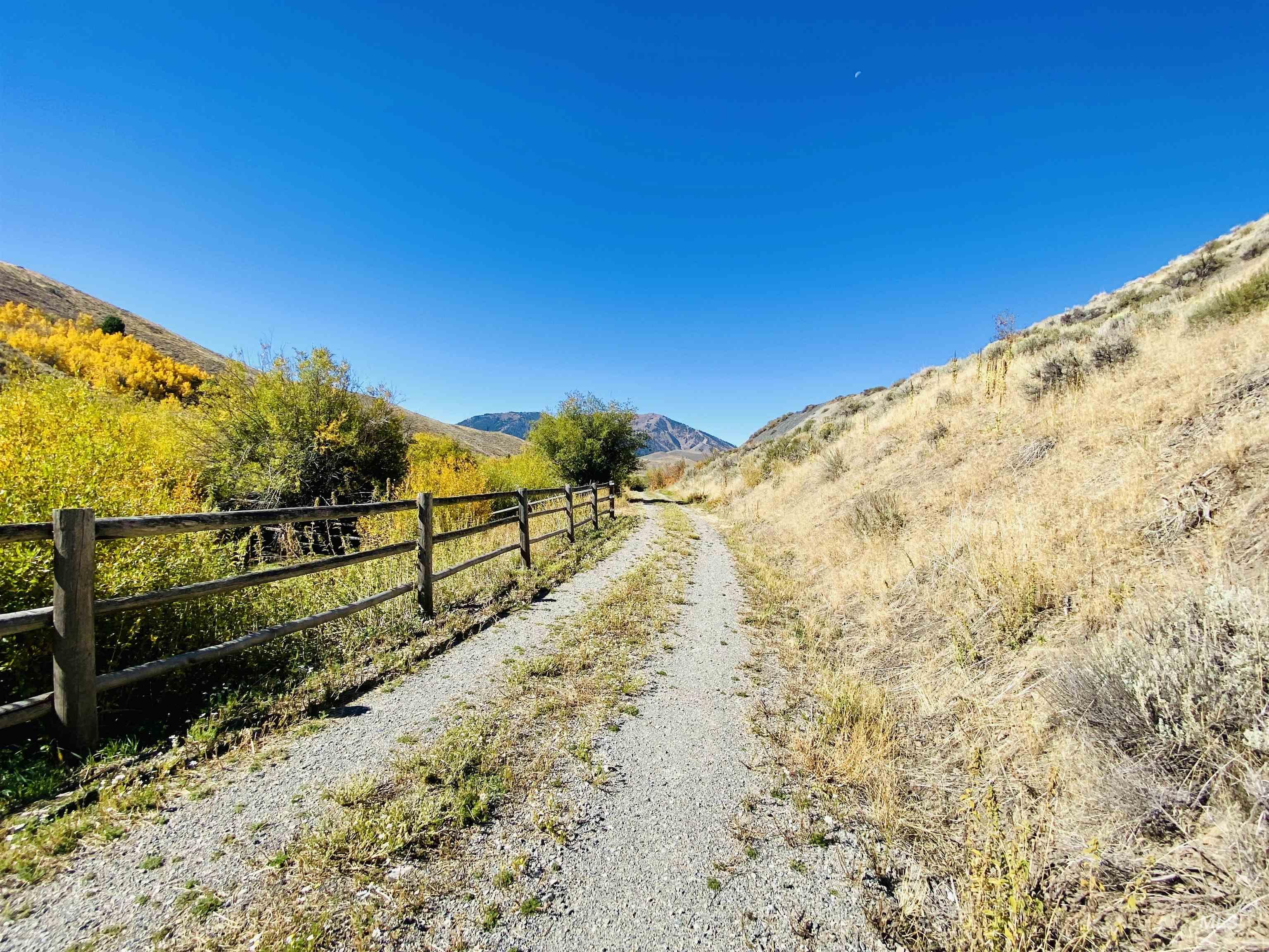 View of dirt / gravel road featuring a mountain view