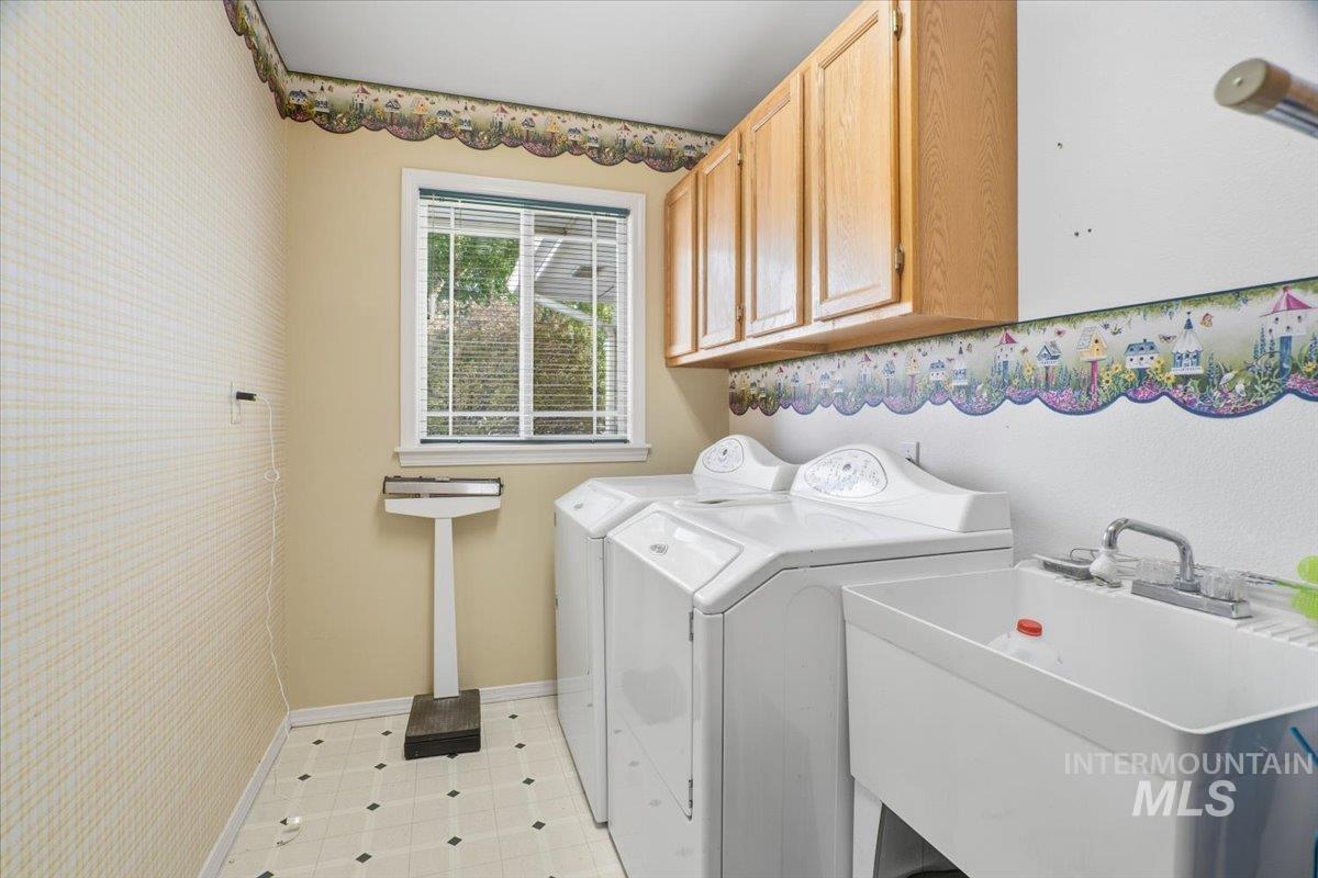 Laundry room with washer, dryer and cabinet space