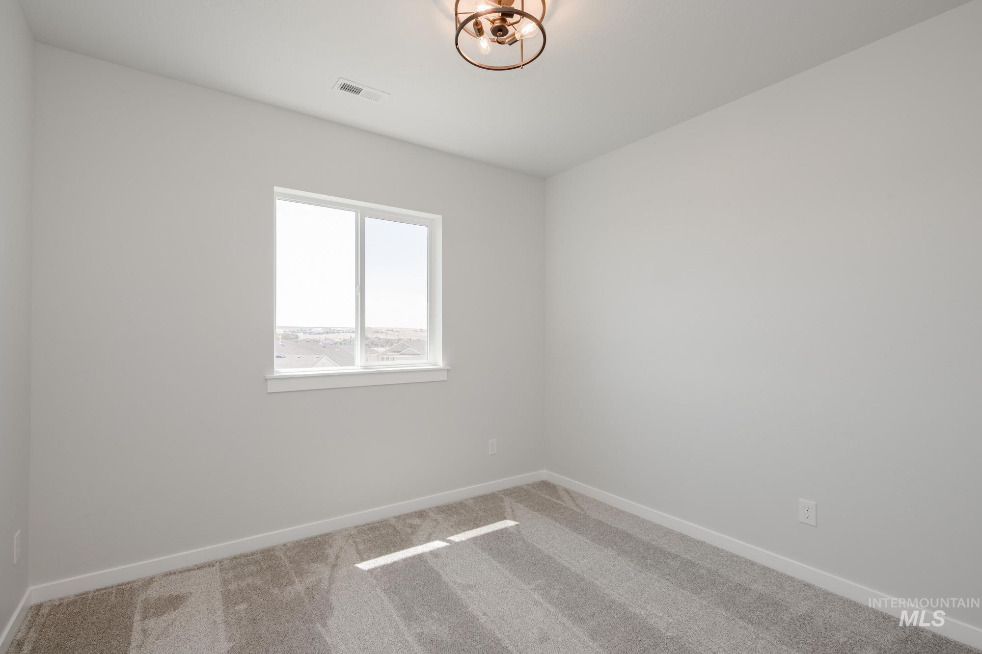 Unfurnished room with carpet floors and baseboards
