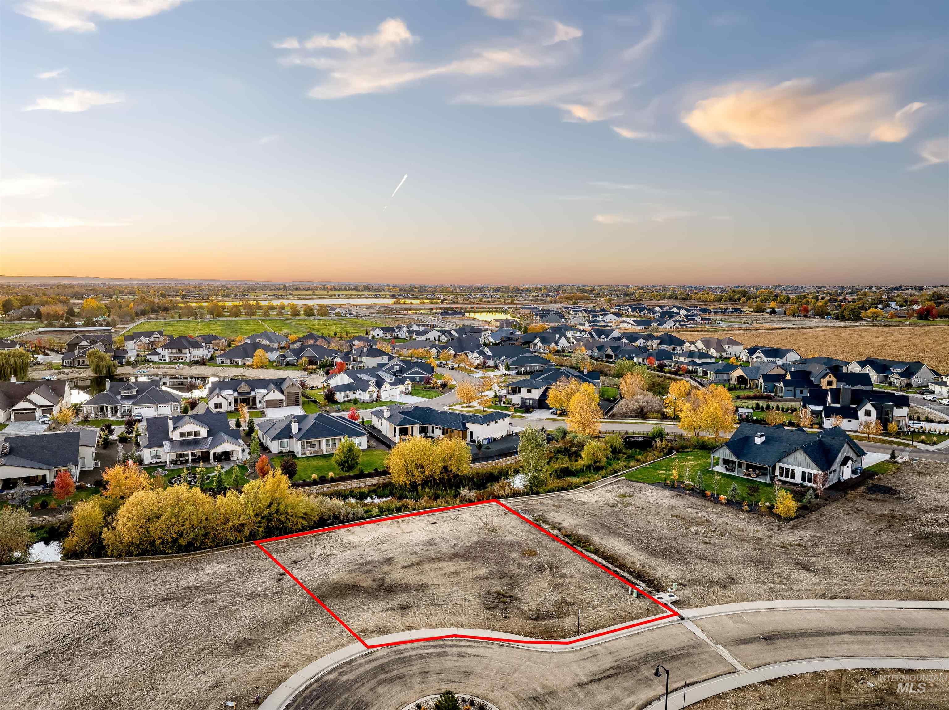 Aerial view at dusk of a residential view and property boundaries highlighted