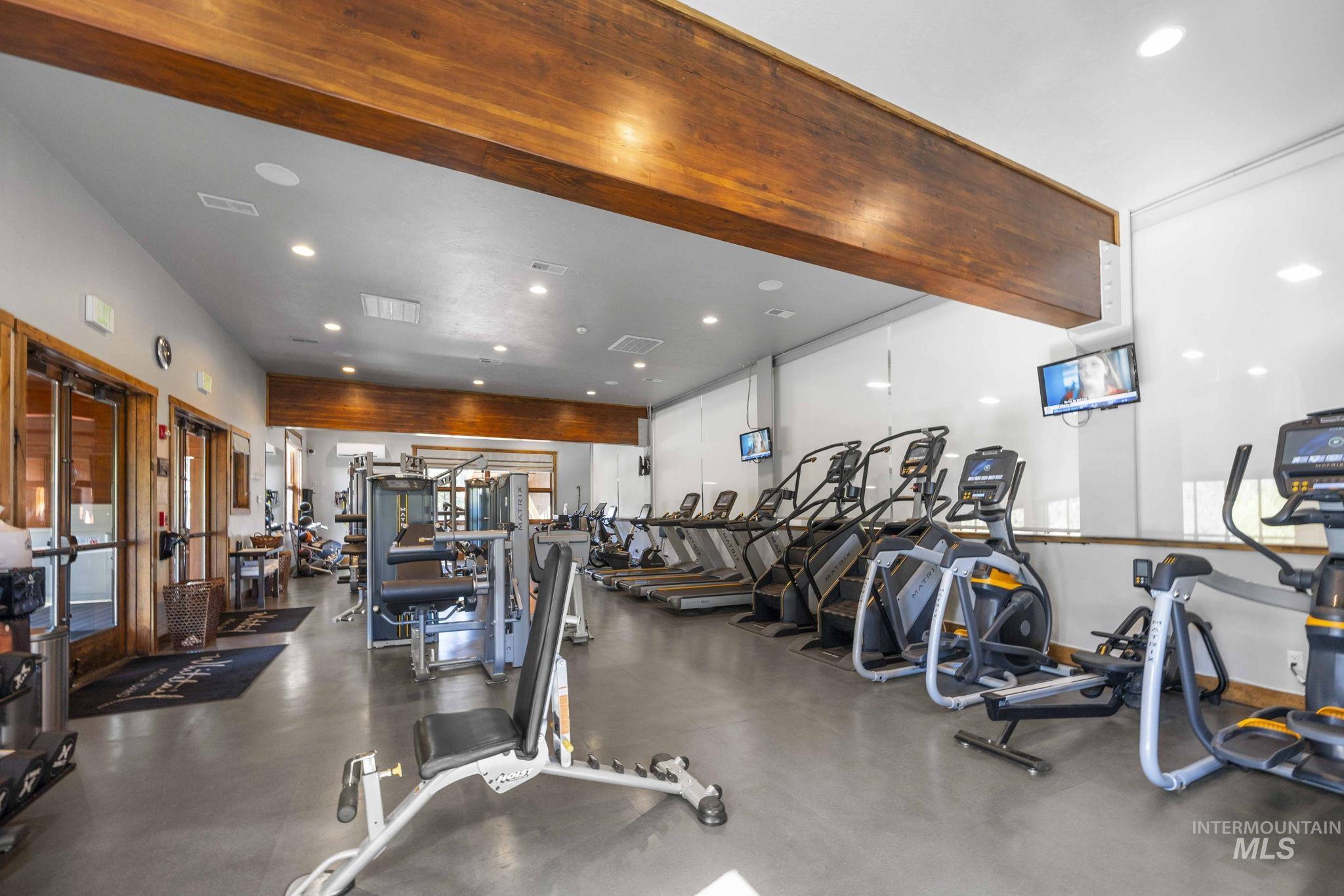 Exercise room featuring recessed lighting