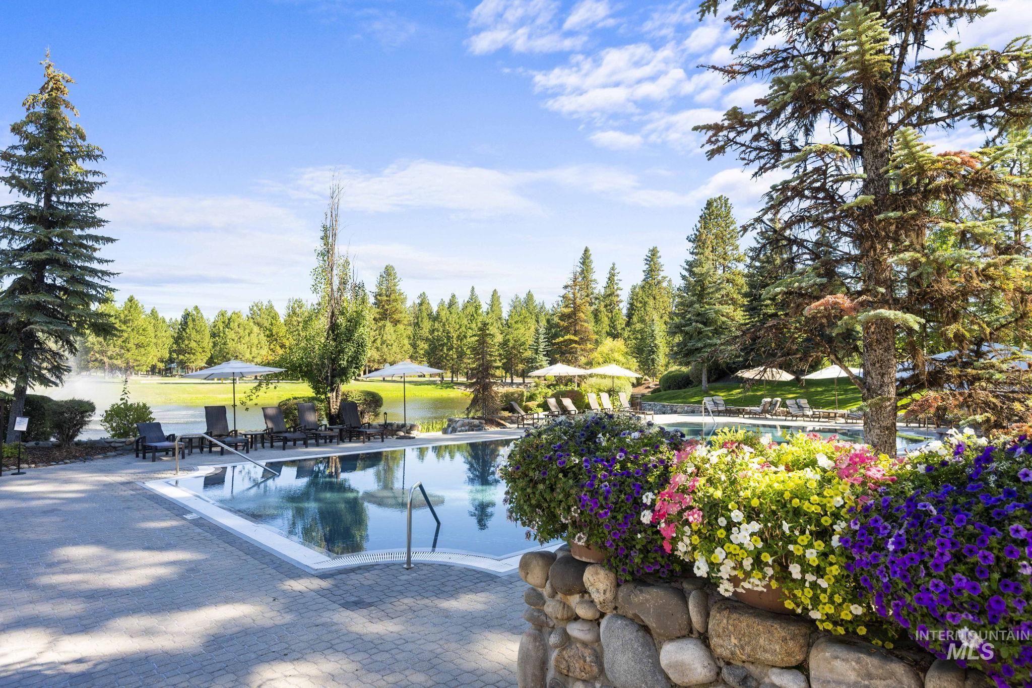 Community pool with a patio